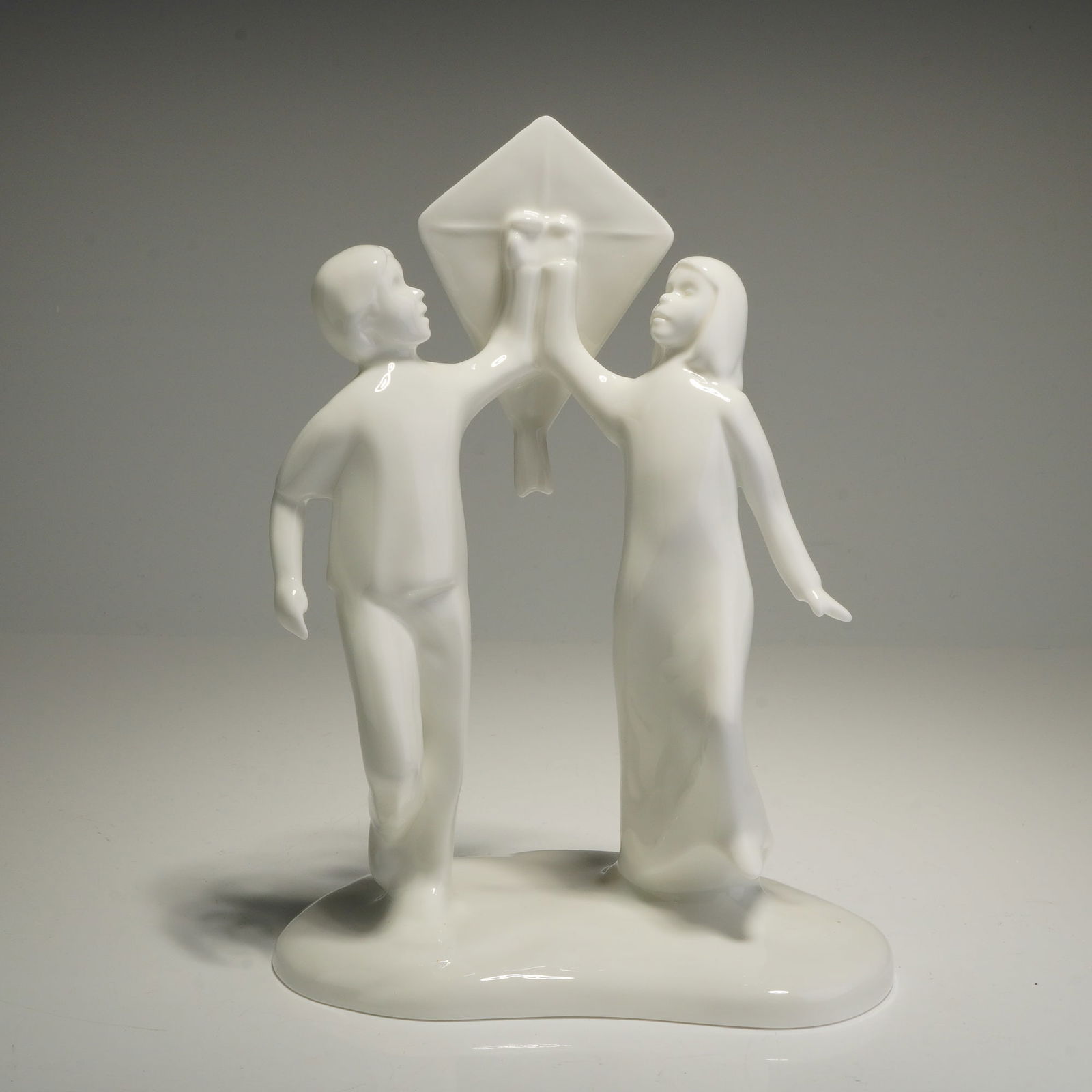 Royal Doulton Images Figurine, Carefree HN 4683: A Royal Doulton bone china figurine titled Carefree, model number HN 4683, from the Images collection. This piece was issued as the Figure of the Year 2005. The modern, stylized sculpture is finished