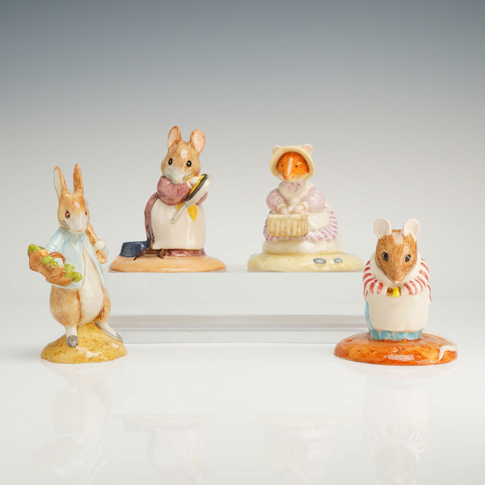 A Collection of Four Beatrix Potter and Brambly Hedge Figurines (1 of 3)