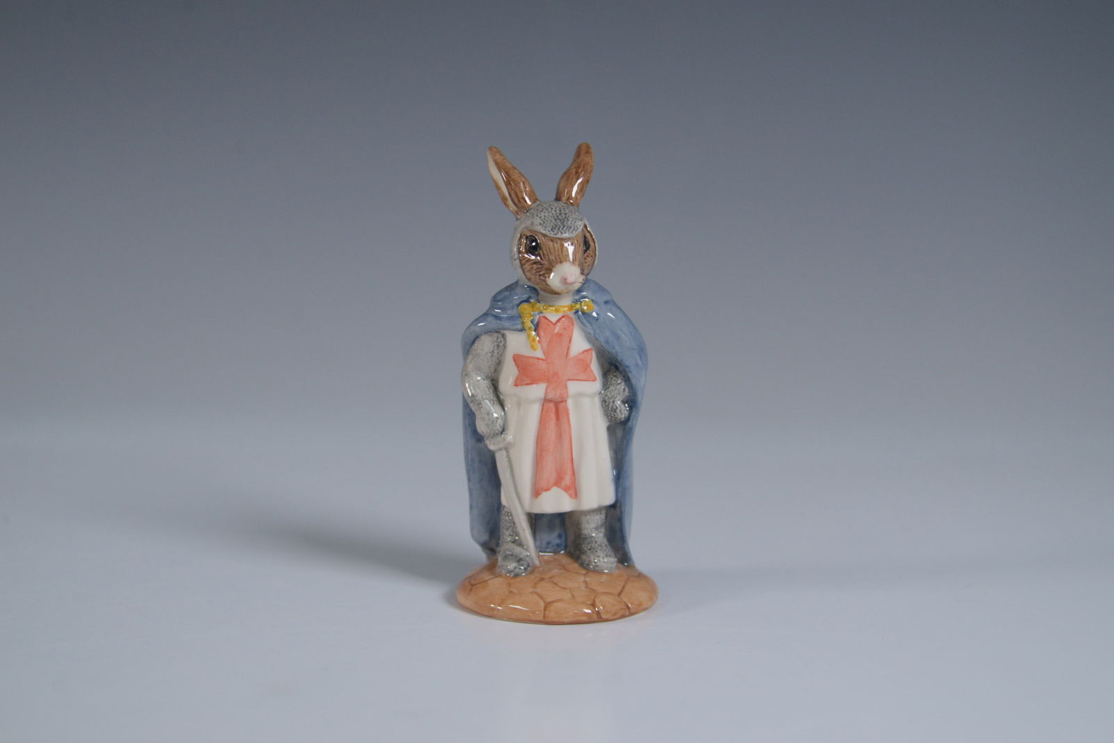 Royal Doulton Bunnykins Figurine, King Richard DB258: Royal Doulton Bunnykins figurine King Richard DB258, part of the Robin Hood Collection. This hand-decorated porcelain figurine depicts a noble rabbit dressed as King Richard the Lionheart, adorned in
