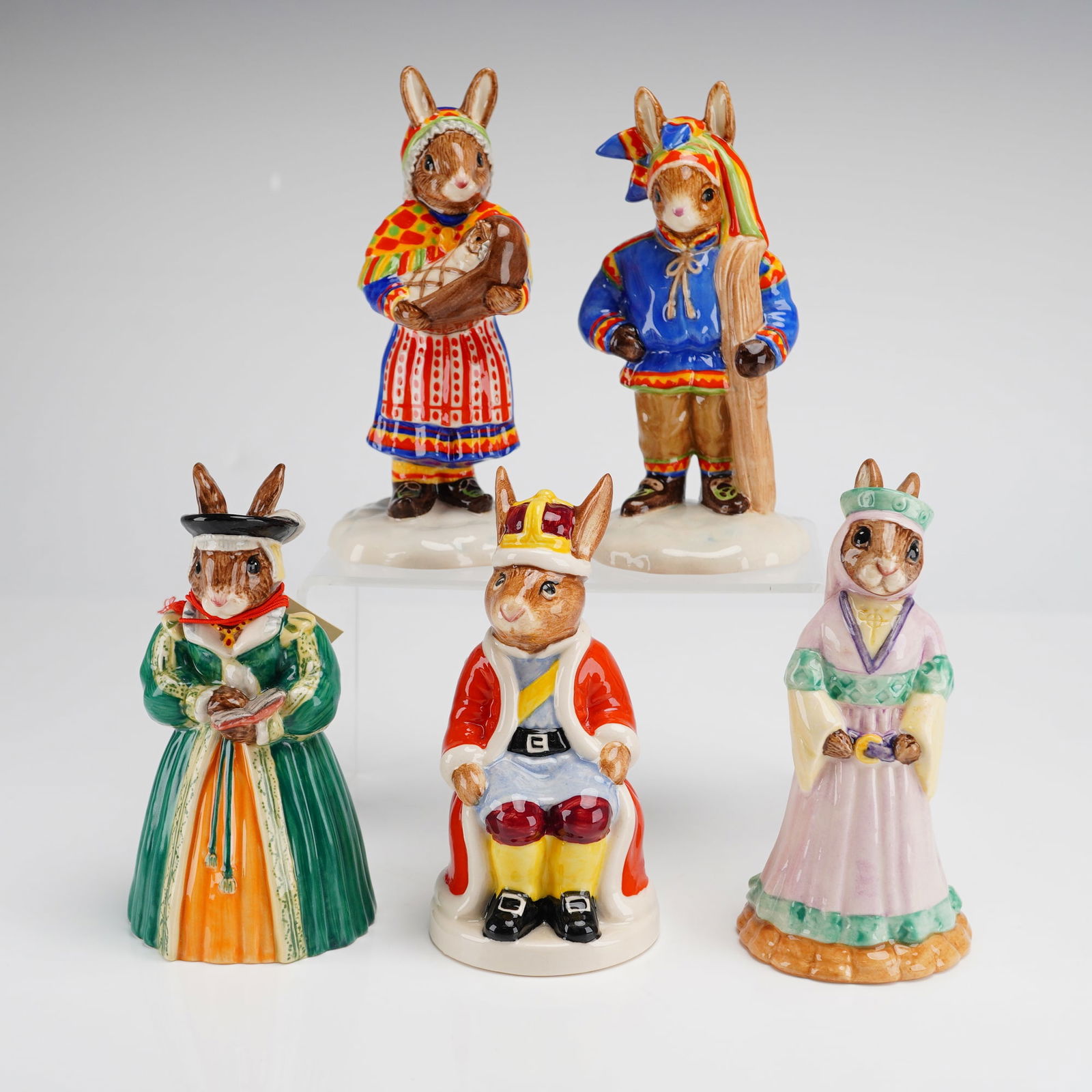 6pc Royal Doulton Bunnykins Figurines King John Maid Marion Lapland: A collection of six hand-made and hand-decorated Royal Doulton Bunnykins ceramic figurines featuring various historical and cultural themes. The group includes King John DB45 from the Royal Family ser