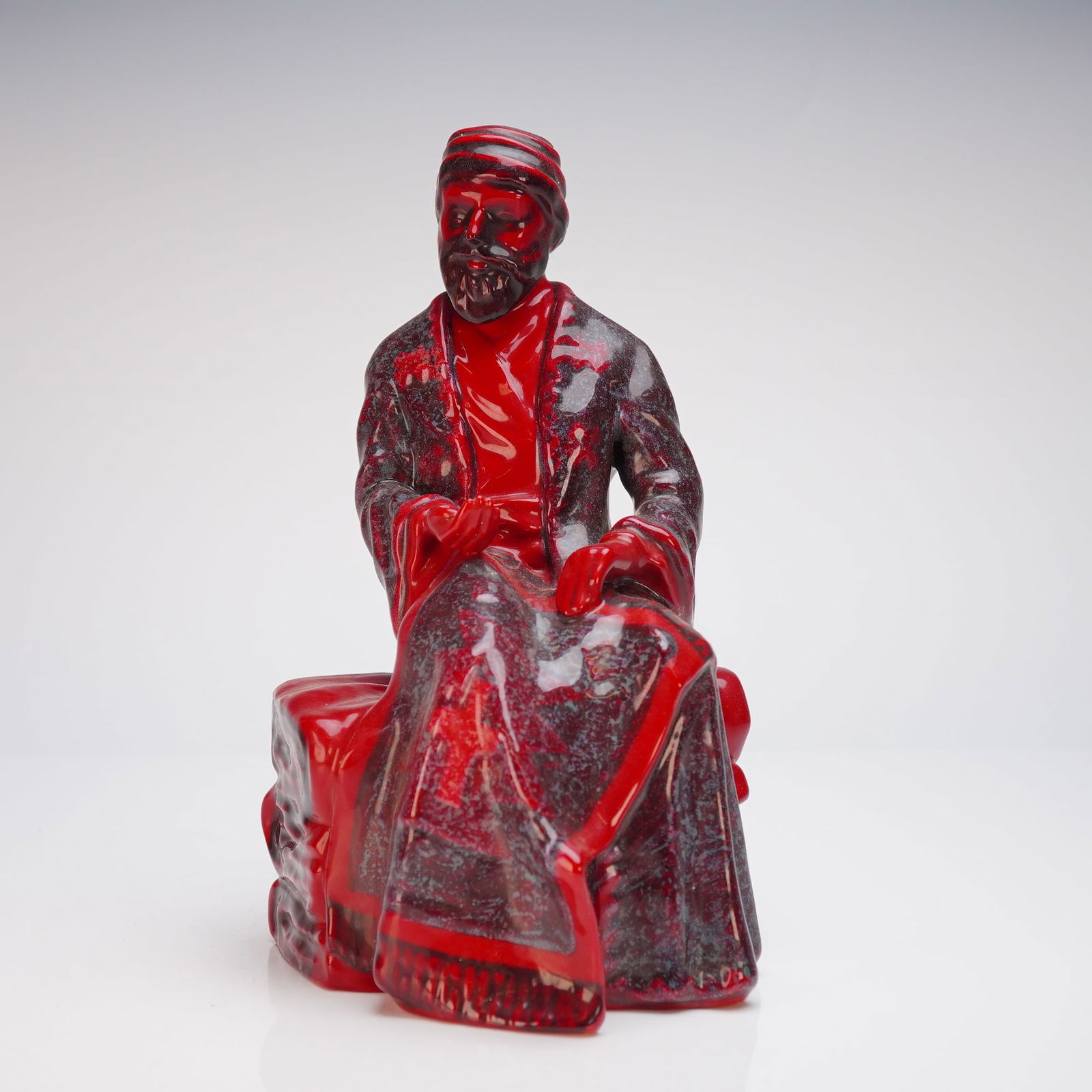 Royal Doulton Flambe Figurine, Carpet Seller (Seated) HN3277 (1 of 5)