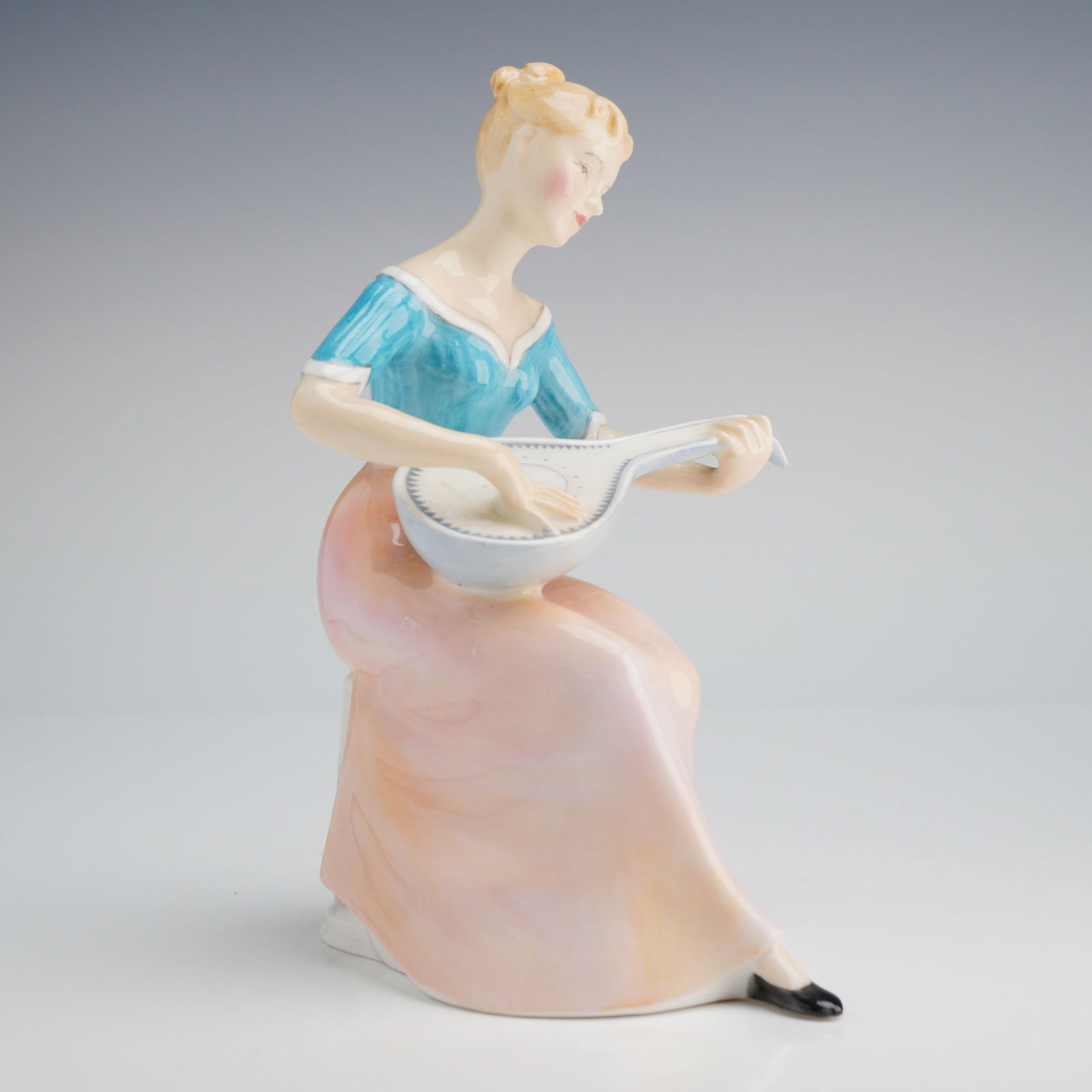 Royal Doulton Figurine, Melody HN 2202: A Royal Doulton figurine, depicting a woman playing a lute with blue and pink glaze, marked Bone China, Doulton & Co. Limited, and copyrighted 1956. Dimensions: 4.25"L x 2.50"W x 6.25"H