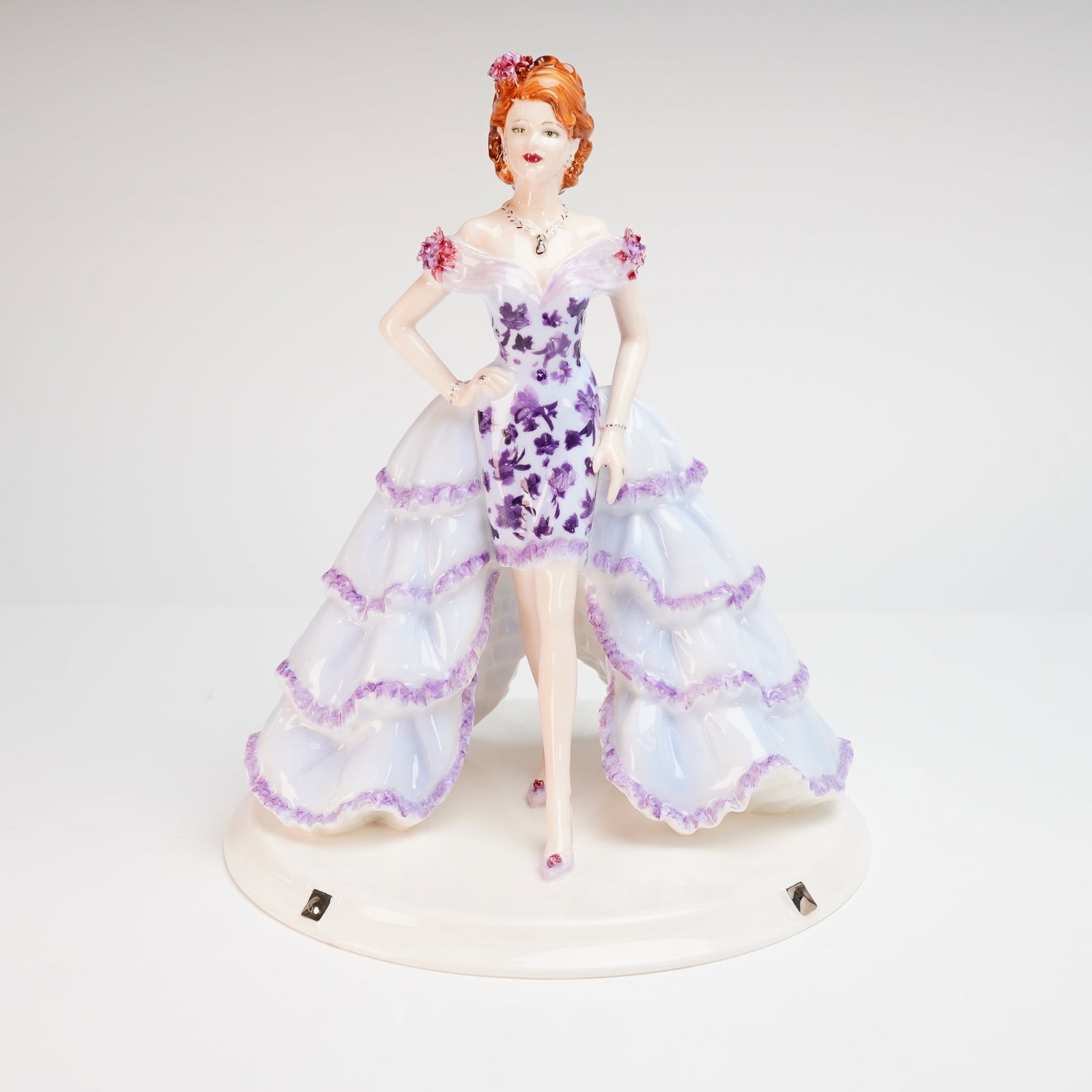 Coalport Limited Edition Figurine Violet VIP David Shilling Collection: A Coalport bone china figurine titled Violet V.I.P. from the David Shilling Celebration Collection, modeled by Jack Glynn. This hand-decorated piece is a limited edition, numbered 38 of 1,000. The fig