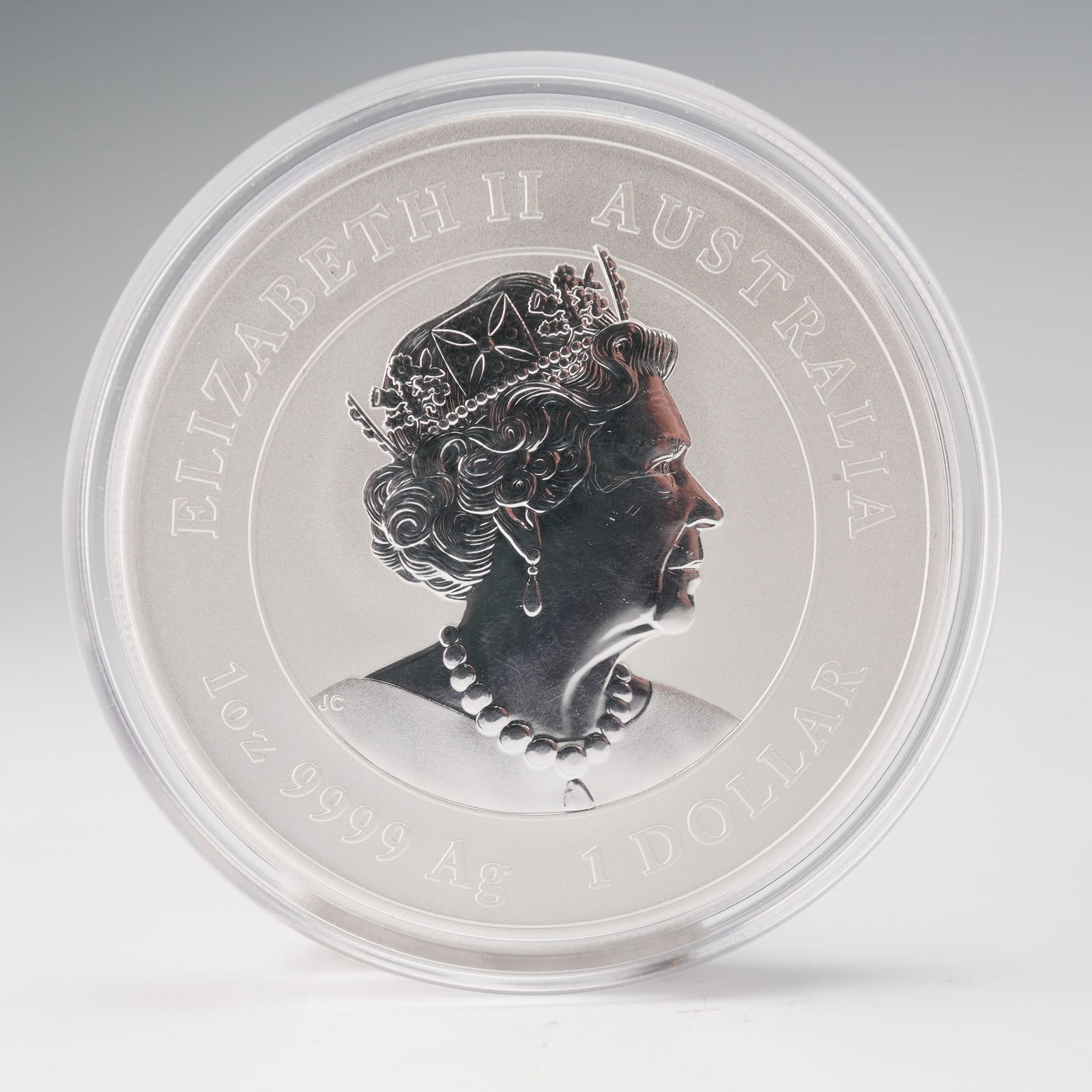 2021 Elizabeth II 1 Silver Dollar Year of the OX Coin: Struck by the Perth Mint, this coin contains 1 troy ounce of 0.9999 fine silver. The obverse features the effigy of Queen Elizabeth II wearing the royal diadem and pearl necklace, surrounded by the in