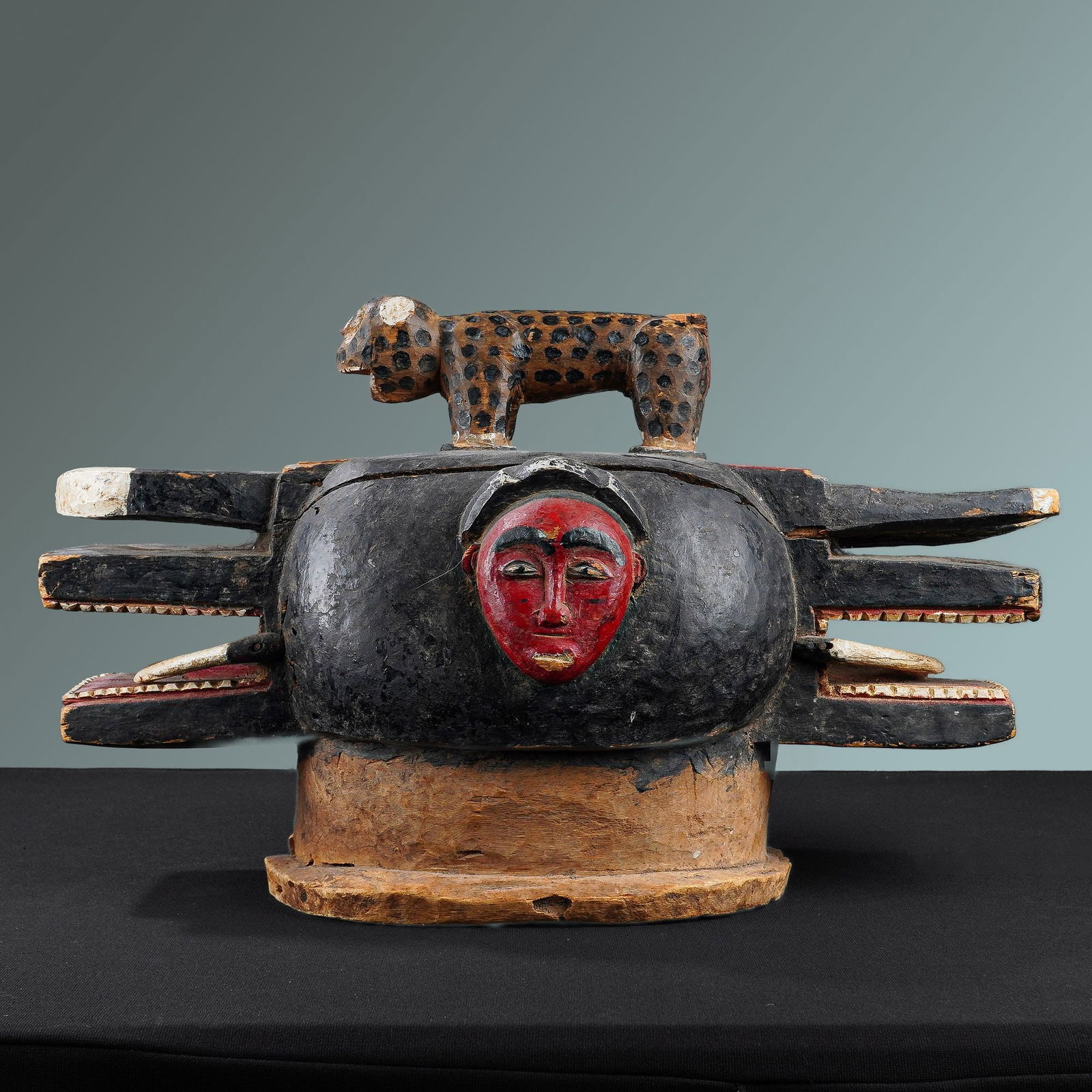 African Baule Goli Glin Helmet Mask: From the Ivory Coast is a carved wooden mask decorated with polychrome pigments. Also known as a Wanyugo. The mask is characterized by a central body with two elongated, open-mouthed snouts featuring