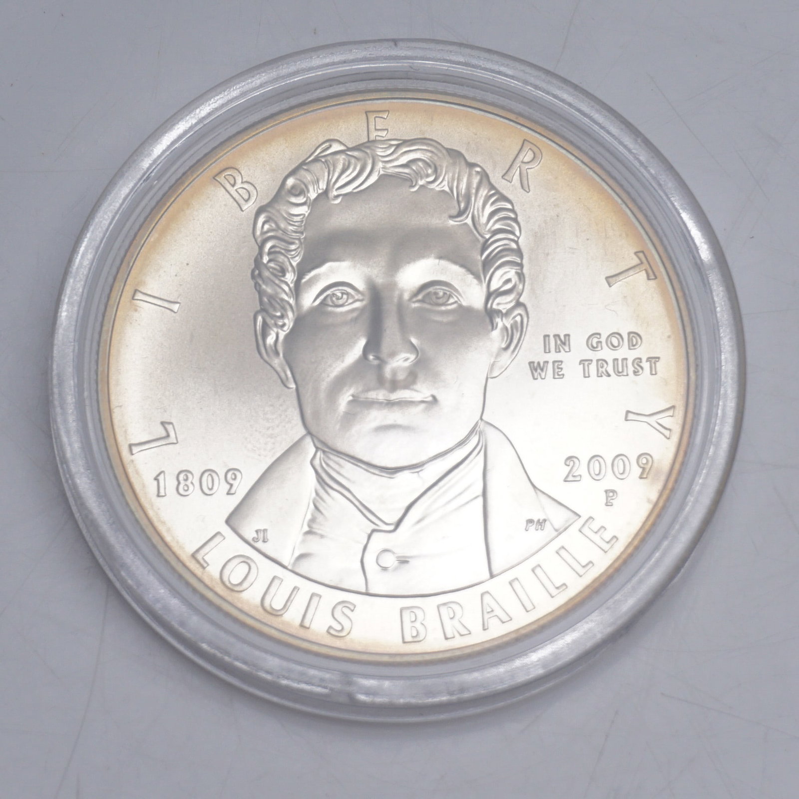 2009-P U.S. Mint Louis Braille Bicentennial Uncirculated Silver Dollar: Commemorating the 200th anniversary of the birth of Louis Braille (1809-1852), this 2009-P Uncirculated Silver Dollar was struck at the Philadelphia Mint in honor of the inventor of the Braille readin