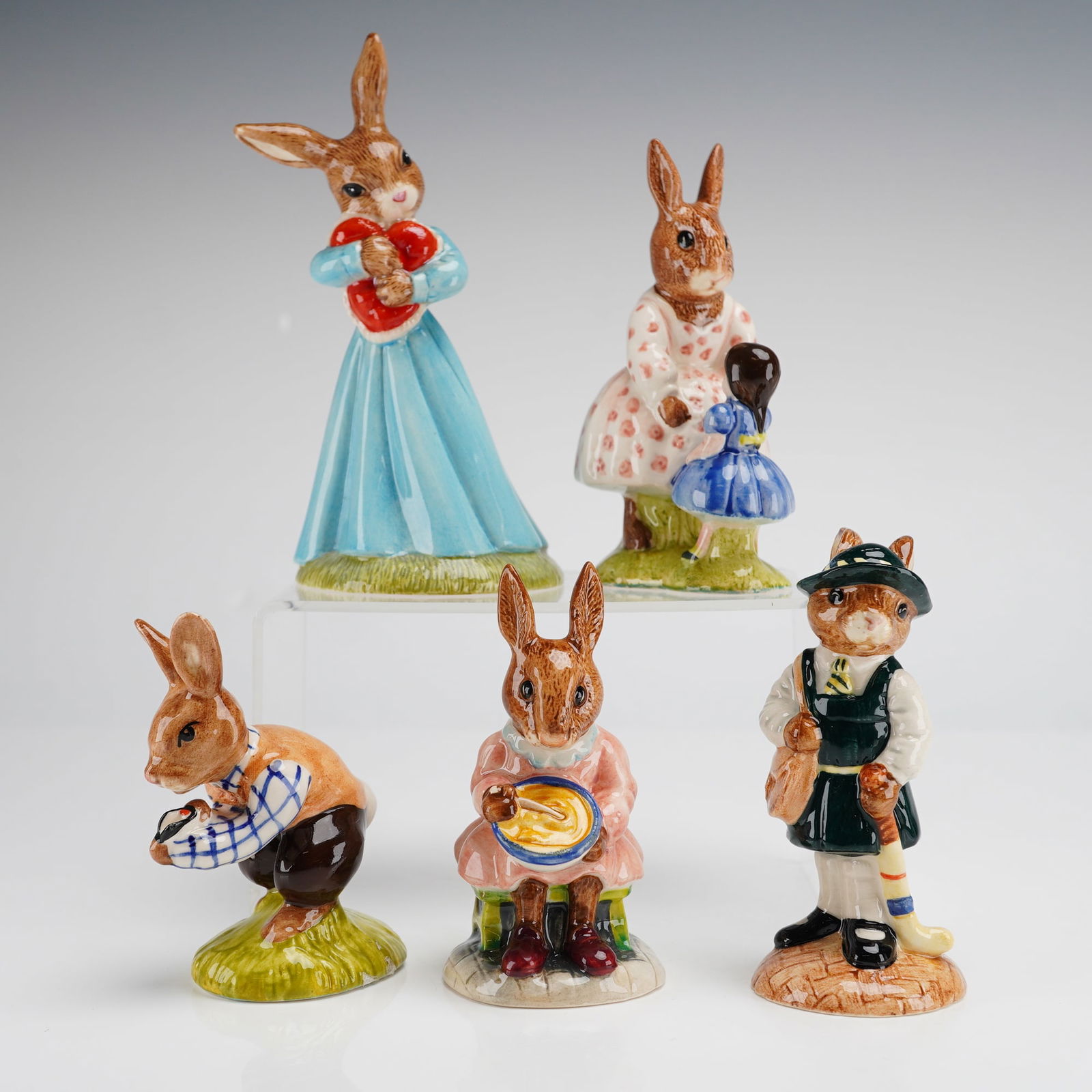 6pc Royal Doulton Bunnykins Figurines Tom Helping Mother Playtime: A collection of 6pc Royal Doulton Bunnykins porcelain figurines. This group features various characters including Tom DB72, Buntie Bunnykins Helping Mother DB002, Dollie Bunnykins Playtime DB008, Love