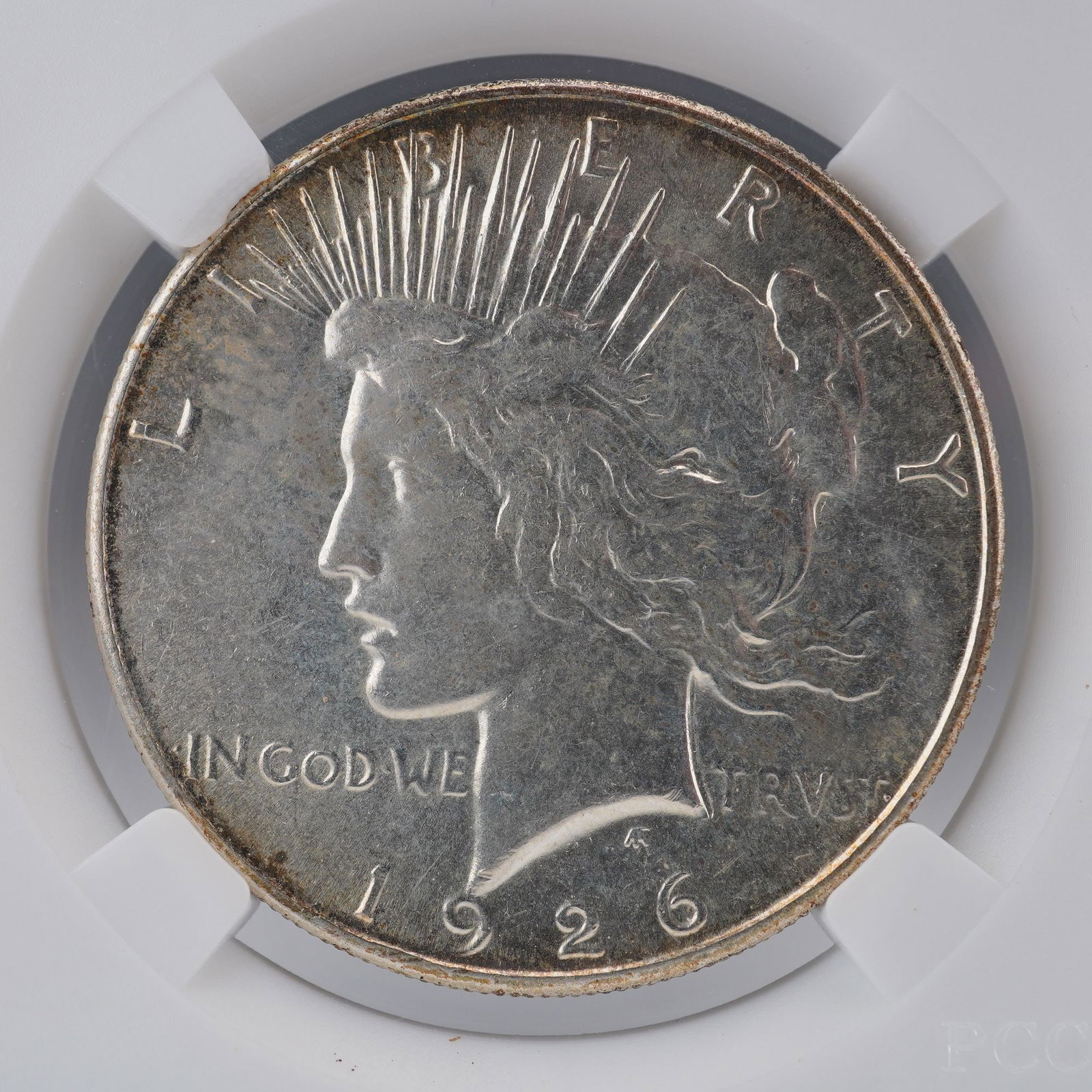 1926-S Peace Silver Dollar: A 1926-S Peace Silver Dollar, struck at the San Francisco Mint and exemplifying the enduring beauty of Anthony de Francisci's celebrated design. he obverse features the serene portrait of Liberty wear