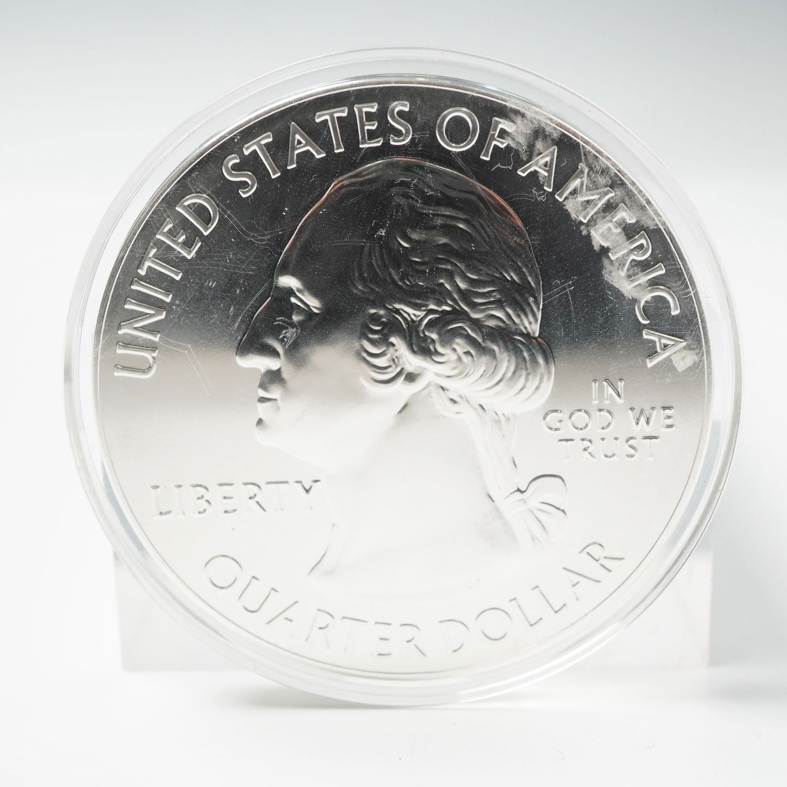 2013 White Mountain Silver 5 oz. Washington Quarter Dollar Coin: This 2013 issue from the America the Beautiful Quarters Program honors White Mountain National Forest in New Hampshire, and contains 5 ounces of .999 fine silver. The obverse displays John Flanagan's