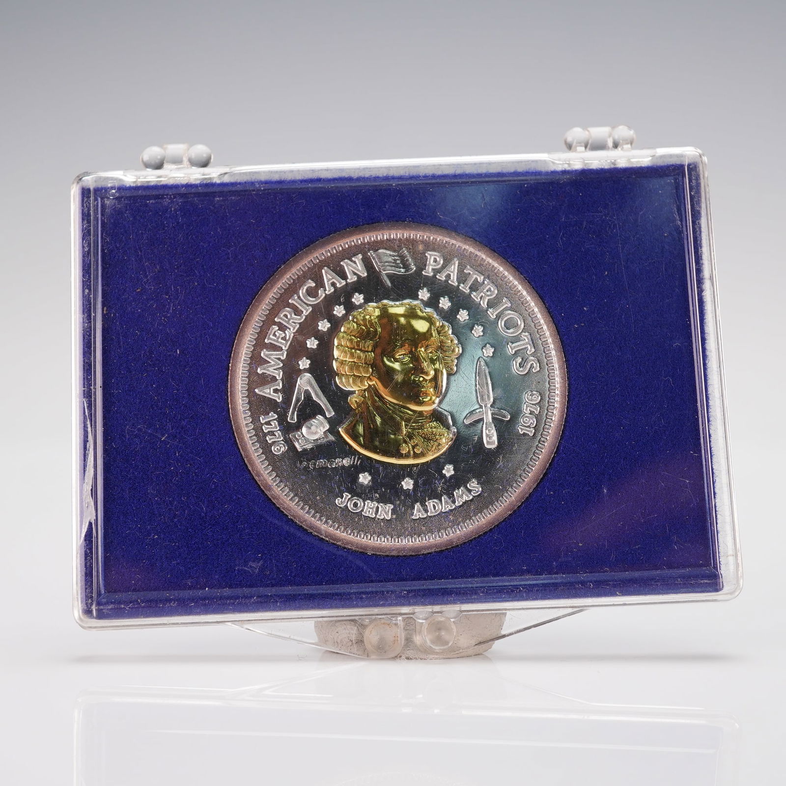 1976-L John Adams American Patriots Bullion: Featuring an obverse portrait of John Adams surrounded by AMERICAN PATRIOTS 1976 and flanked by patriotic motifs, with reverse inscriptions VINCIT AMOR PATRIAE, STRUCK IN THE UNITED STATES OF AMERICA,