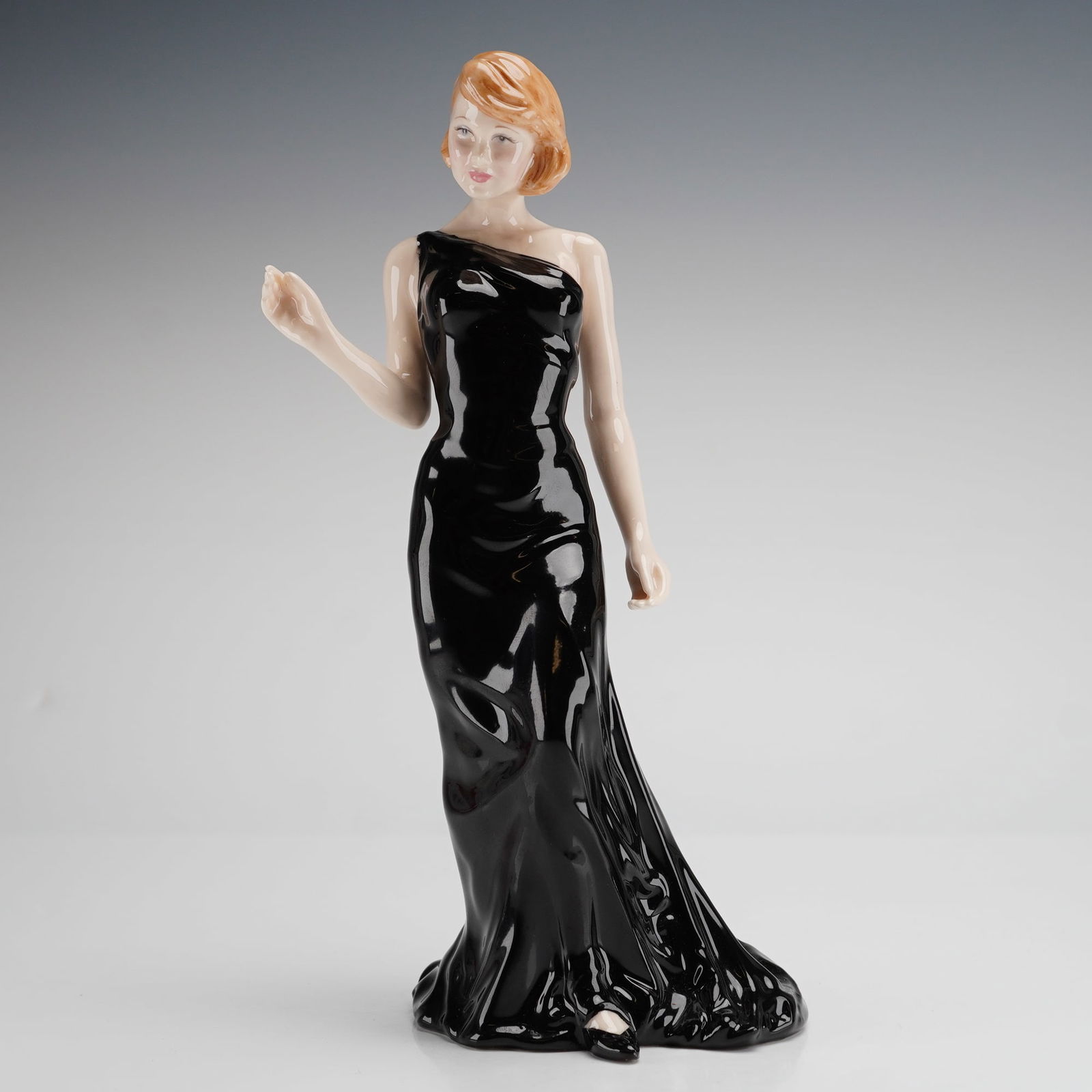 Royal Doulton Nadine Figurine HN 4500: A Royal Doulton bone china figurine titled Nadine, model number HN 4500, from the Classics In Vogue collection. This piece was modeled by Valerie Annand and is dated 2003. The figure depicts a