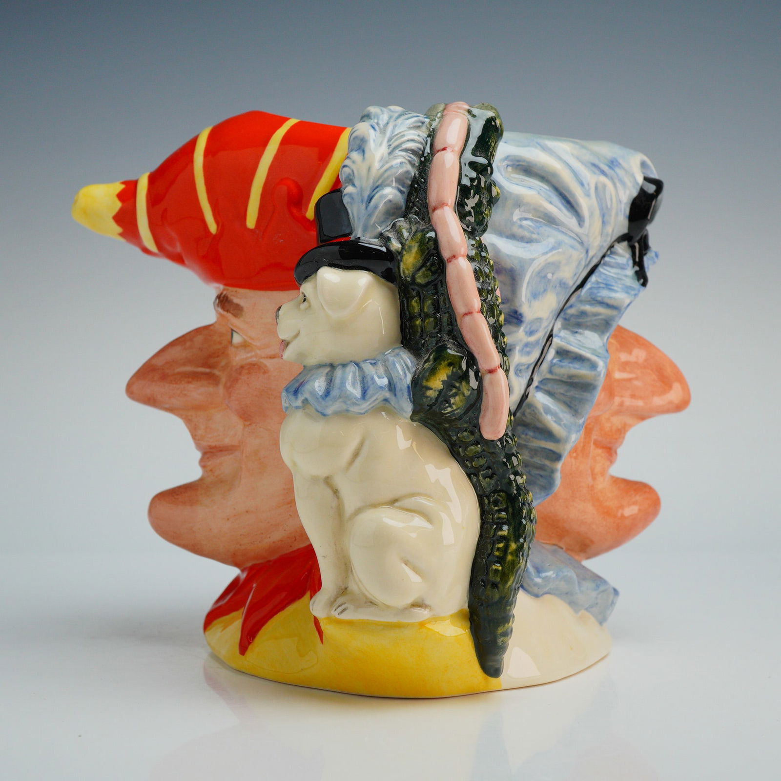 Royal Doulton Punch and Judy Double Sided Character Jug D6946 w/ COA: This large size Royal Doulton character jug, model D6946, is a double-sided ceramic piece featuring the traditional characters of Punch and Judy. Modeled by Stanley James Taylor and produced in 1993,