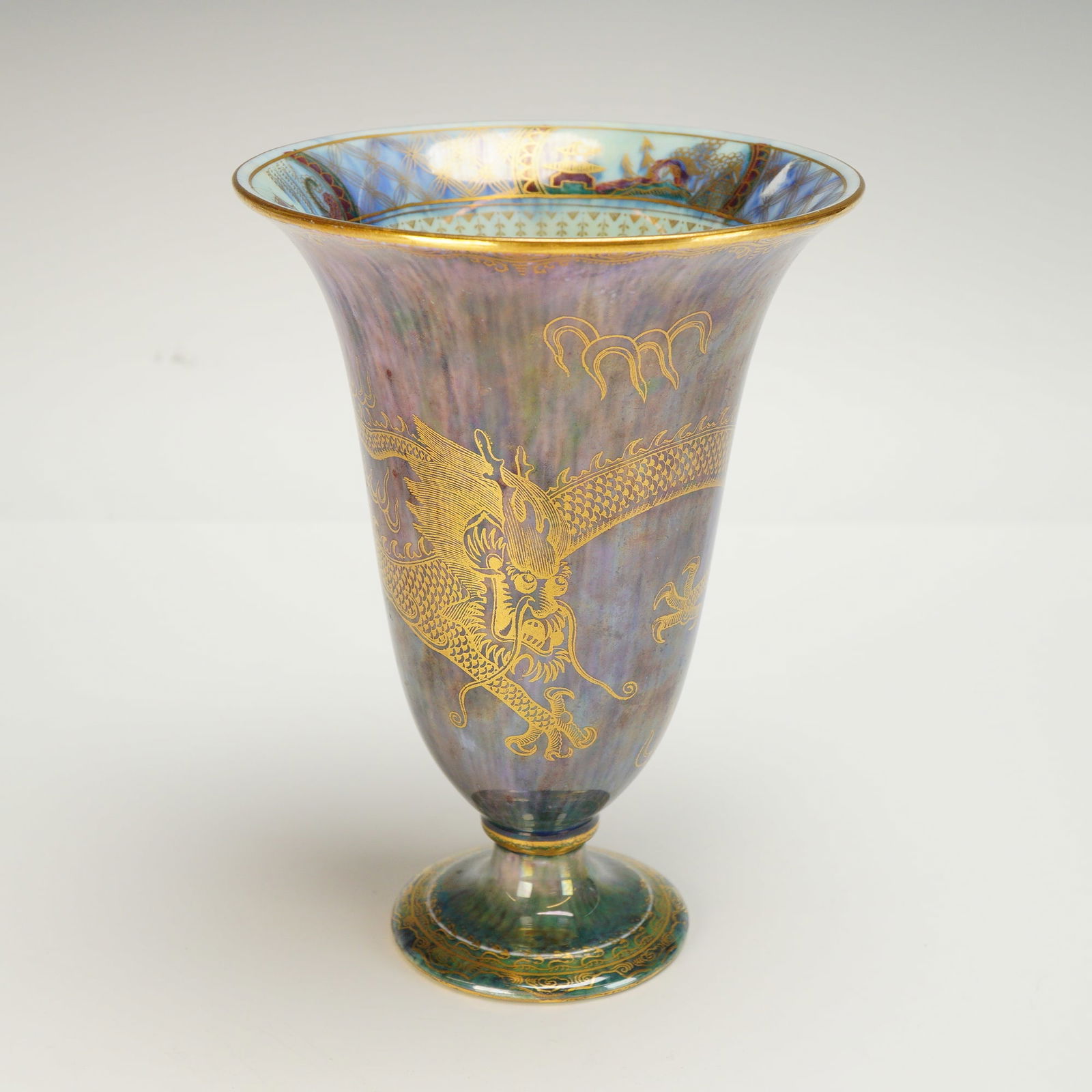 Wedgwood Fairyland Lustre Bowl, Celestial Dragon Z4831: Designed by Daisy Makeig-Jones (British, 1881-1945). The exterior features a green lustre with all-color mottling and a gold-decorated "Celestial Dragon" with "Sacred Flames," with an "Aquatic Bead" b