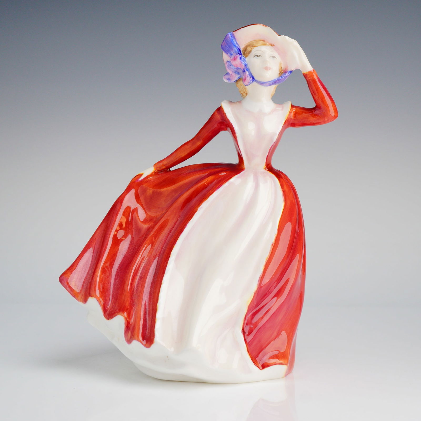 Royal Doulton Figurine, Mary HN 3903: A single Royal Doulton figurine, depicting a woman in a red and white dress, marked for The Peggy Davies Collection and dated 1997. Royal Doulton backstamp on base. Dimensions6.25"L x 4.75"W x 7.50"H