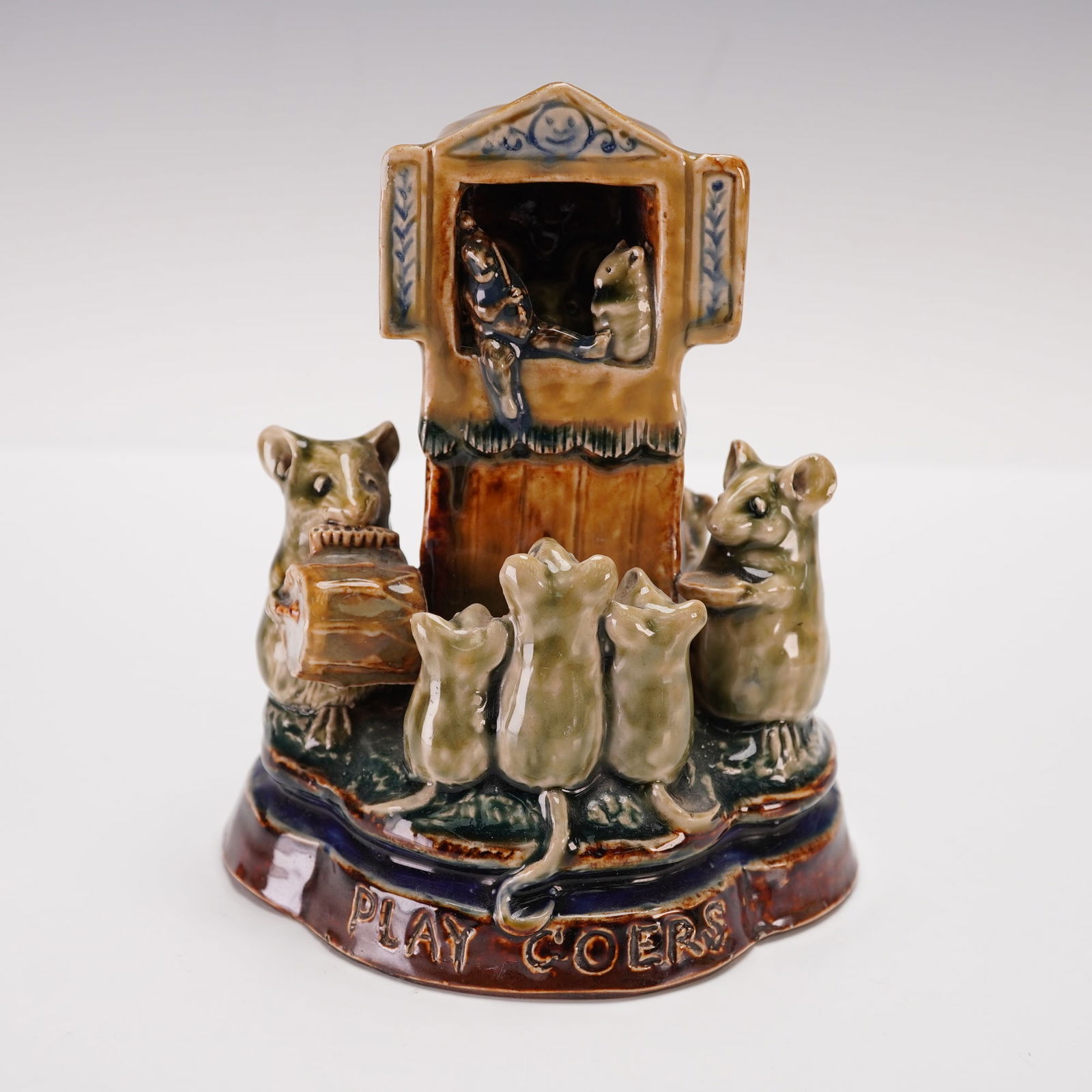 Doulton Lambeth by George Tinworth Stoneware Figural Grouping, Playgoers: Handcrafted and glazed stoneware figural group depicting anthropomorphic mice attending a puppet show. The piece shows detailed modeling of the seated mouse audience, a mouse puppeteer, and stage elem