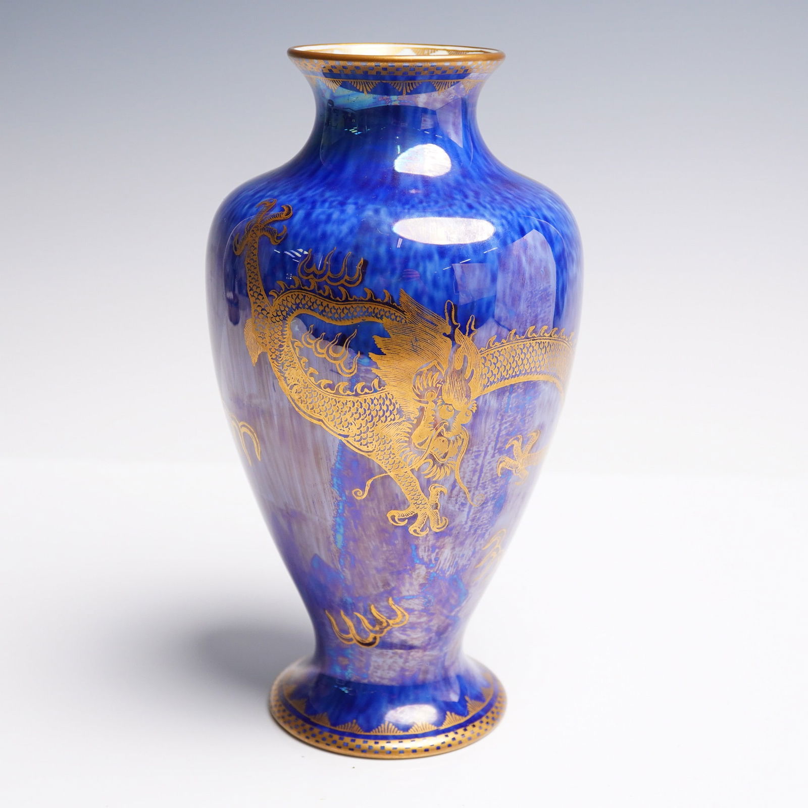 Wedgwood Fairyland Lustre Vase, Celestial Dragon Z4829: This vase exemplifies the luxurious aesthetic of Wedgwood's lustreware collection, created under the direction of Daisy Makeig-Jones. Shaped in a tall baluster form with a gently flared rim and circul