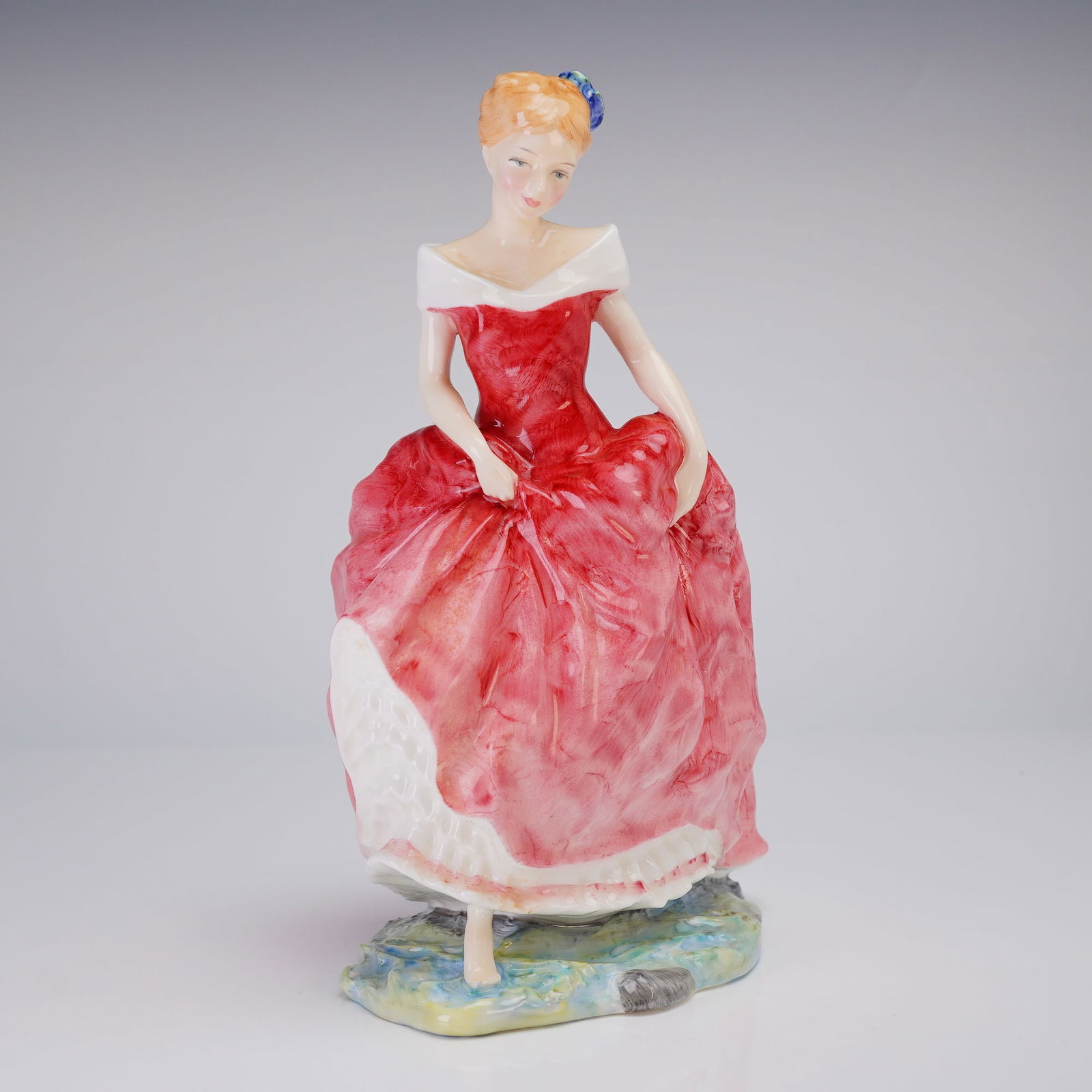 Royal Doulton Figurine Summers Day HN 3378: A Royal Doulton porcelain figurine depicting a woman in a red and white dress with blue accents, marked 1991 First Year of Issue and signed by Timothy Hiles. Dimensions: 5.75"L x 4.25"W x 8.50"H Weigh