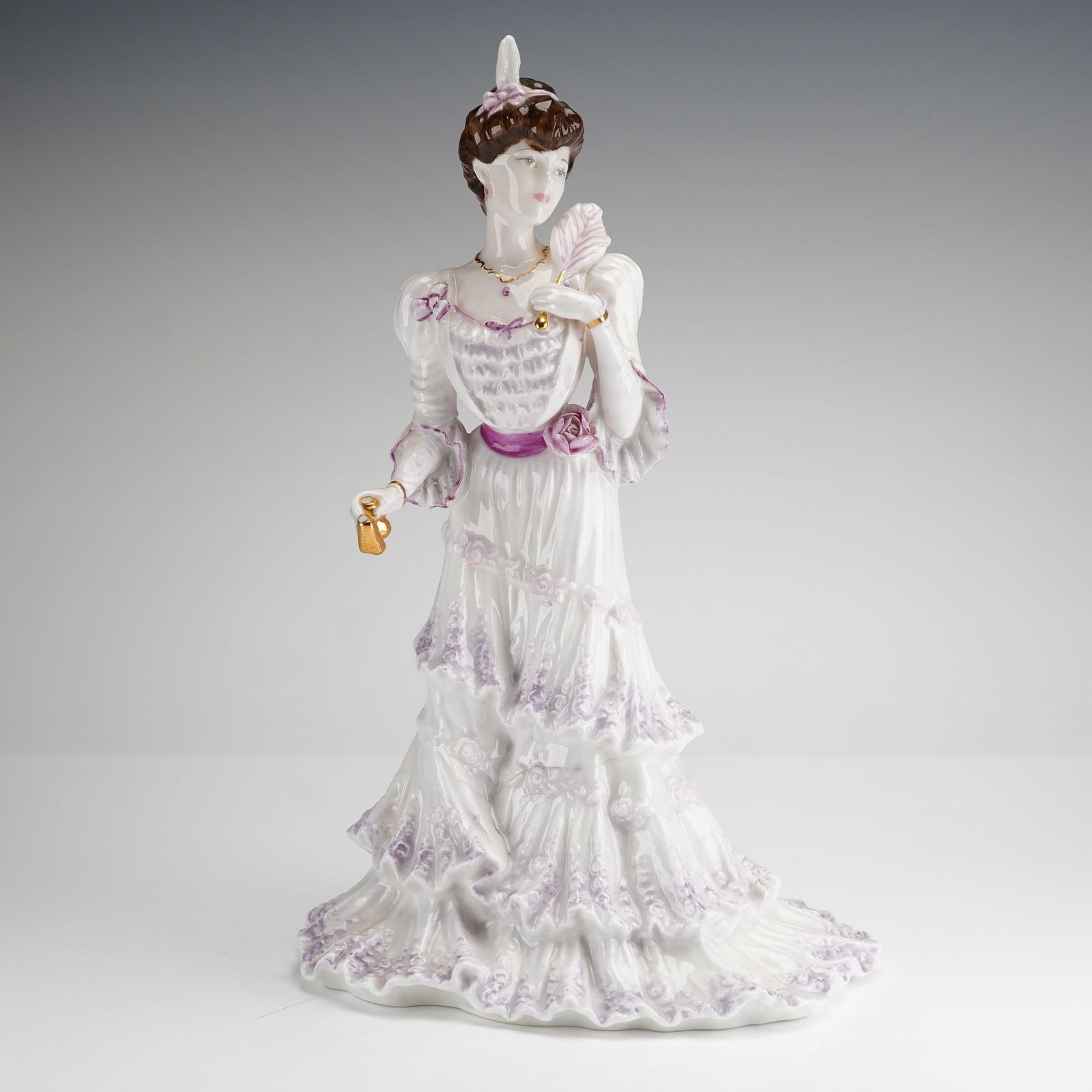 Coalport Golden Age Eugenie First Night at the Opera Figurine: A Coalport fine bone china figurine titled Eugenie First Night at the Opera, part of the Golden Age collection. This limited edition piece is numbered 2386 of a production run of 12,500. The figure wa