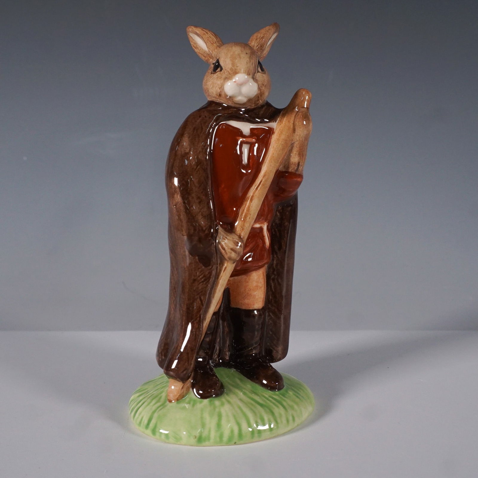 Royal Doulton Bunnykins Little John Figurine DB243: From Royal Doulton's beloved Bunnykins series, this hand-painted and hand-decorated porcelain figurine depicts Little John from The Robin Hood Collection. Designed with rich earthy tones, this charmin