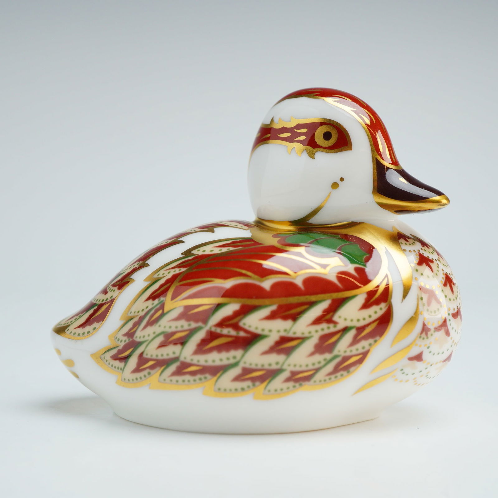 Royal Crown Derby Paperweight, Bakewell Duckling: This Royal Crown Derby paperweight is an exclusive edition produced for Sinclairs. The figurine is constructed from English fine bone china and decorated in a stylized Imari pattern featuring vibrant