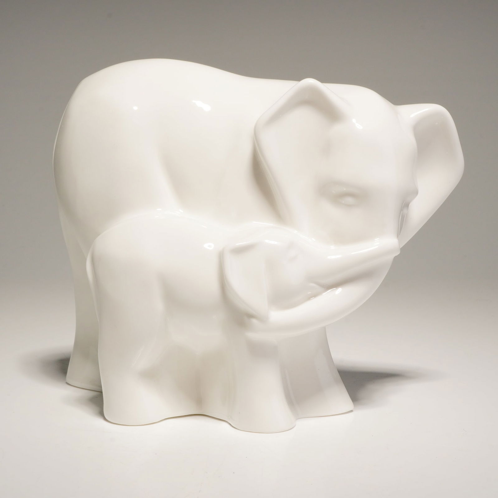 Coalport Moments Bone China Figurine, Tender Moment: This Coalport bone china figurine, titled Tender Moment, is part of the Moments by Coalport collection. The piece is rendered in a white glazed finish and features a stylized, minimalist
