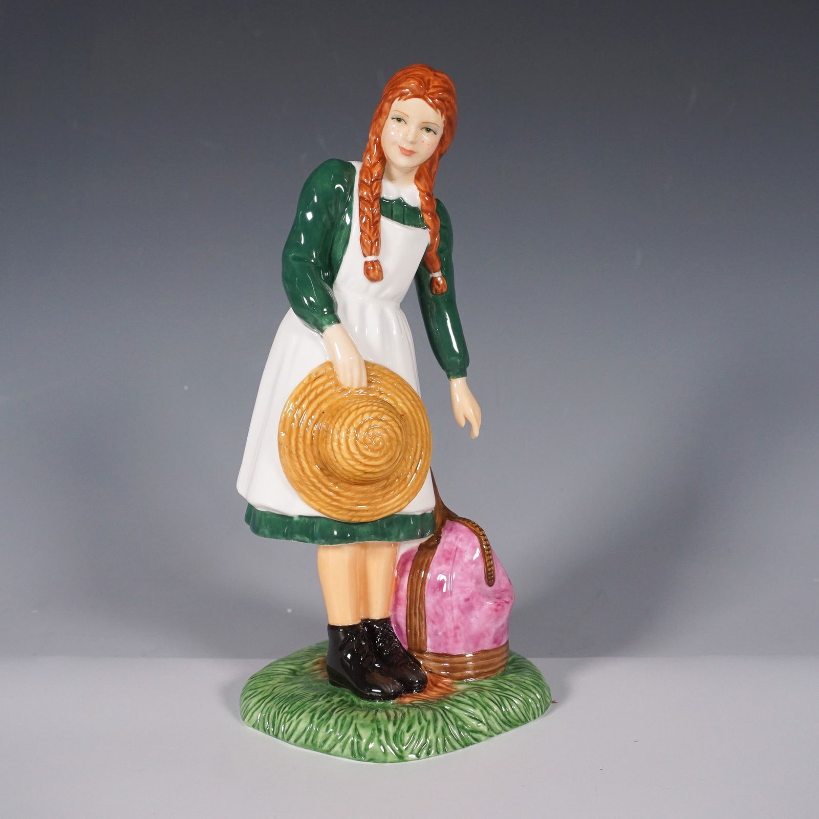 Royal Doulton Figurine, Anne Arrives at Green Gables HN5225: This Royal Doulton figurine brings to life the beloved character of Anne Shirley as she begins her journey at Green Gables. Designed by Nada Pedley, this limited edition piece captures Anne's charm