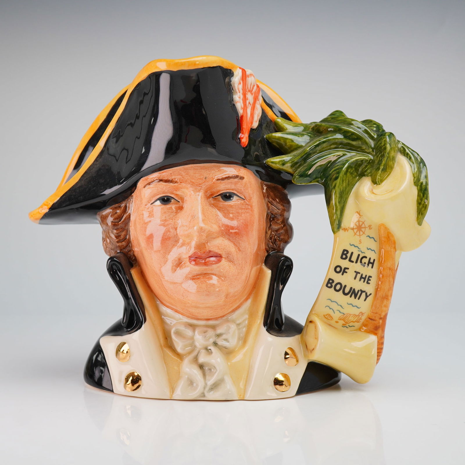 Royal Doulton Large Character Jug, Captain Bligh D6967: This piece was issued as the Character Jug of the Year 1995 and was modeled by Stanley James Taylor. The ceramic vessel depicts the naval officer in a black bicorne hat with yellow trim and a naval un