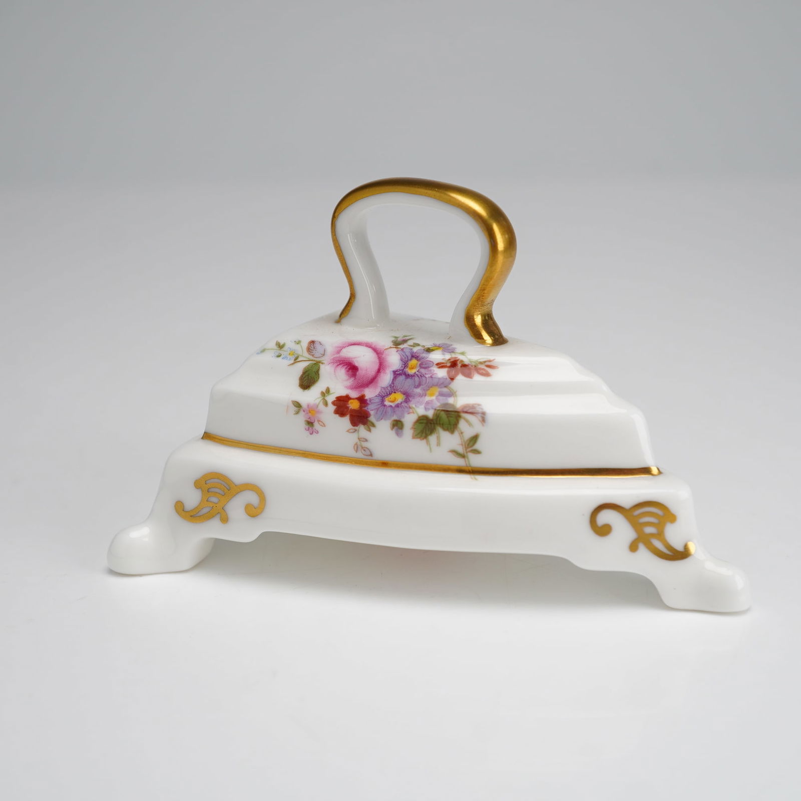 Royal Crown Derby Miniature Iron Paperweight: A Royal Crown Derby English bone china miniature iron paperweight decorated in the Derby Posies pattern. The piece is modeled in the form of a traditional flat iron featuring a stepped lid and a loop
