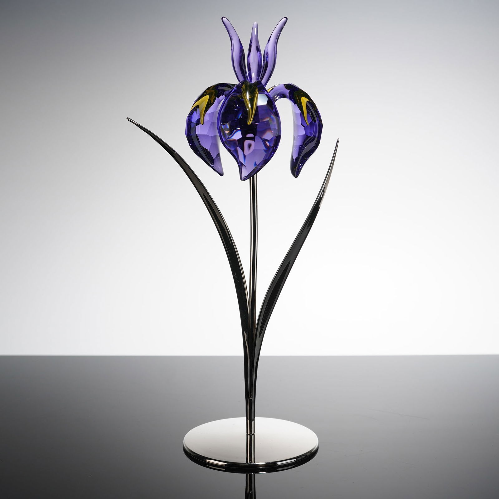 Swarovski Crystal Paradise Flower Damboa Blue Violet Figurine: A Swarovski Crystal Paradise Flowers figurine, identified by the model name Damboa Blue Violet (848449). The sculpture depicts a stylized iris flower, constructed from highly faceted crystal predomina