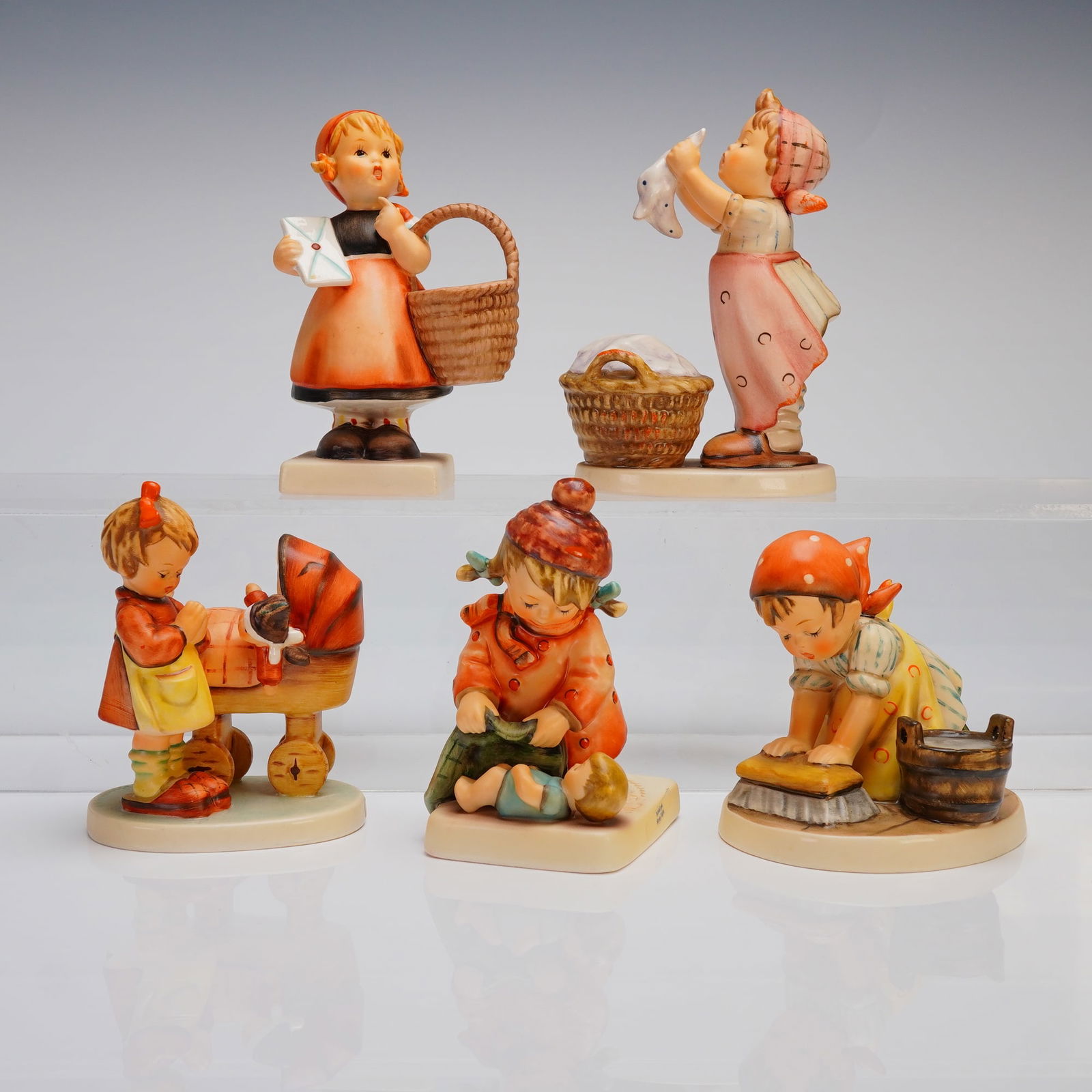 A Collection of 5 Goebel M.I. Hummel Ceramic Figurines, including Wash Day (1 of 3)