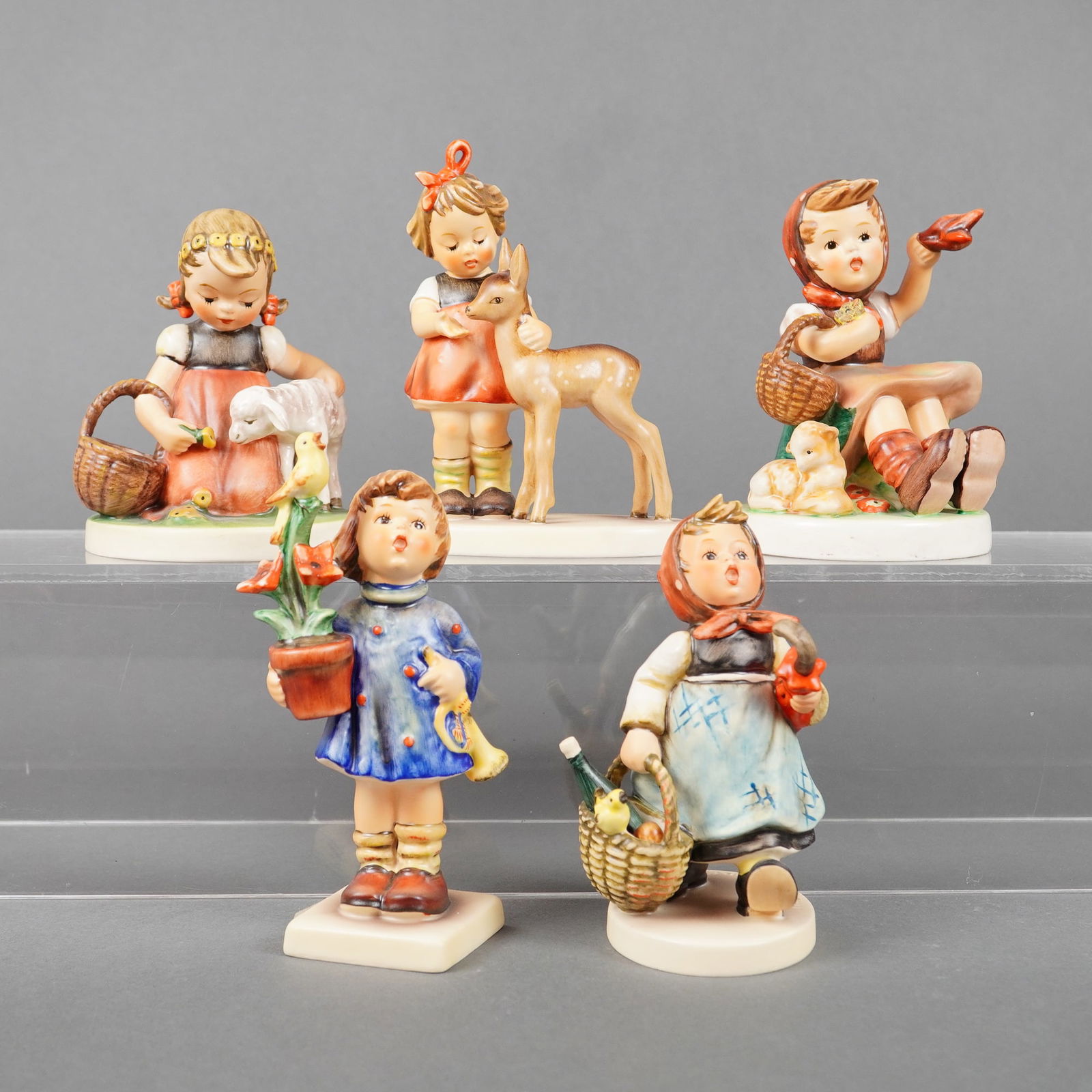 A Collection of Five Goebel M.I. Hummel Ceramic Figurines (1 of 3)