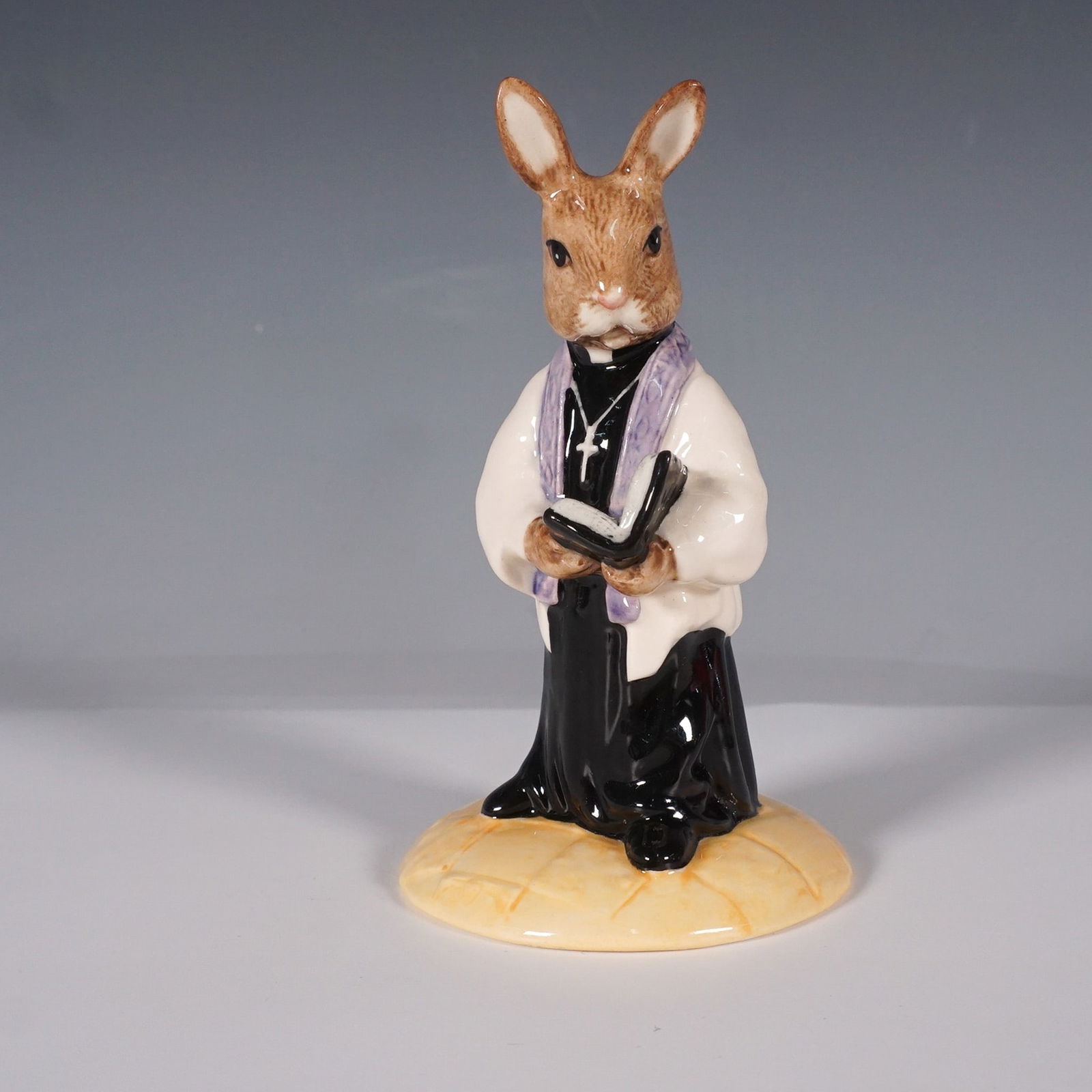 Royal Doulton Bunnykins Figurine, Vicar DB 254: This charming Royal Doulton Bunnykins figurine, titled Vicar Bunnykins (DB 254), was exclusively produced for the Royal Doulton International Collectors Club. Crafted in fine bone china and hand-decor