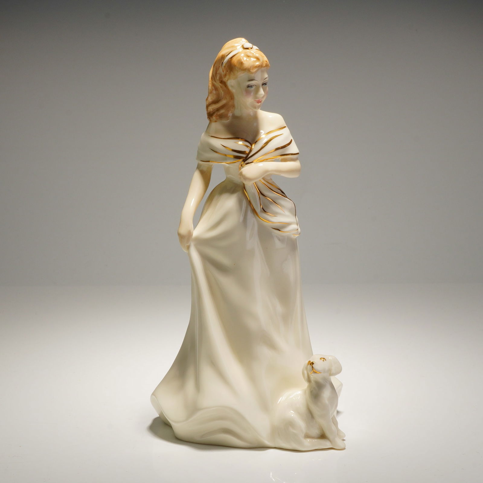 Royal Doulton Morning Walk HN3860 Bone China Figurine: A Royal Doulton bone china figurine titled Morning Walk, model number HN 3860. This piece is part of the Ivory and Gold collection and was modeled by Timothy Potts. The figurine is constructed of hand