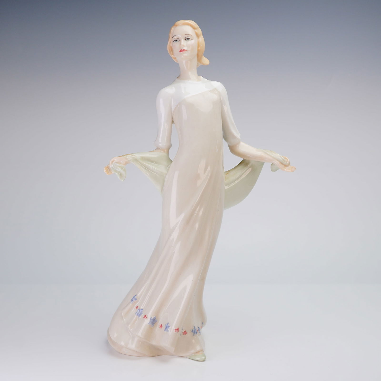 Royal Doulton Sculpture, Enchanting Evening HN3108: A single Royal Doulton Sculpture, Enchanting Evening HN3108, depicting a woman in a cream and pale green gown, modeled by Robert Jefferson and copyrighted 1988. Royal Doulton backstamp as well as mode