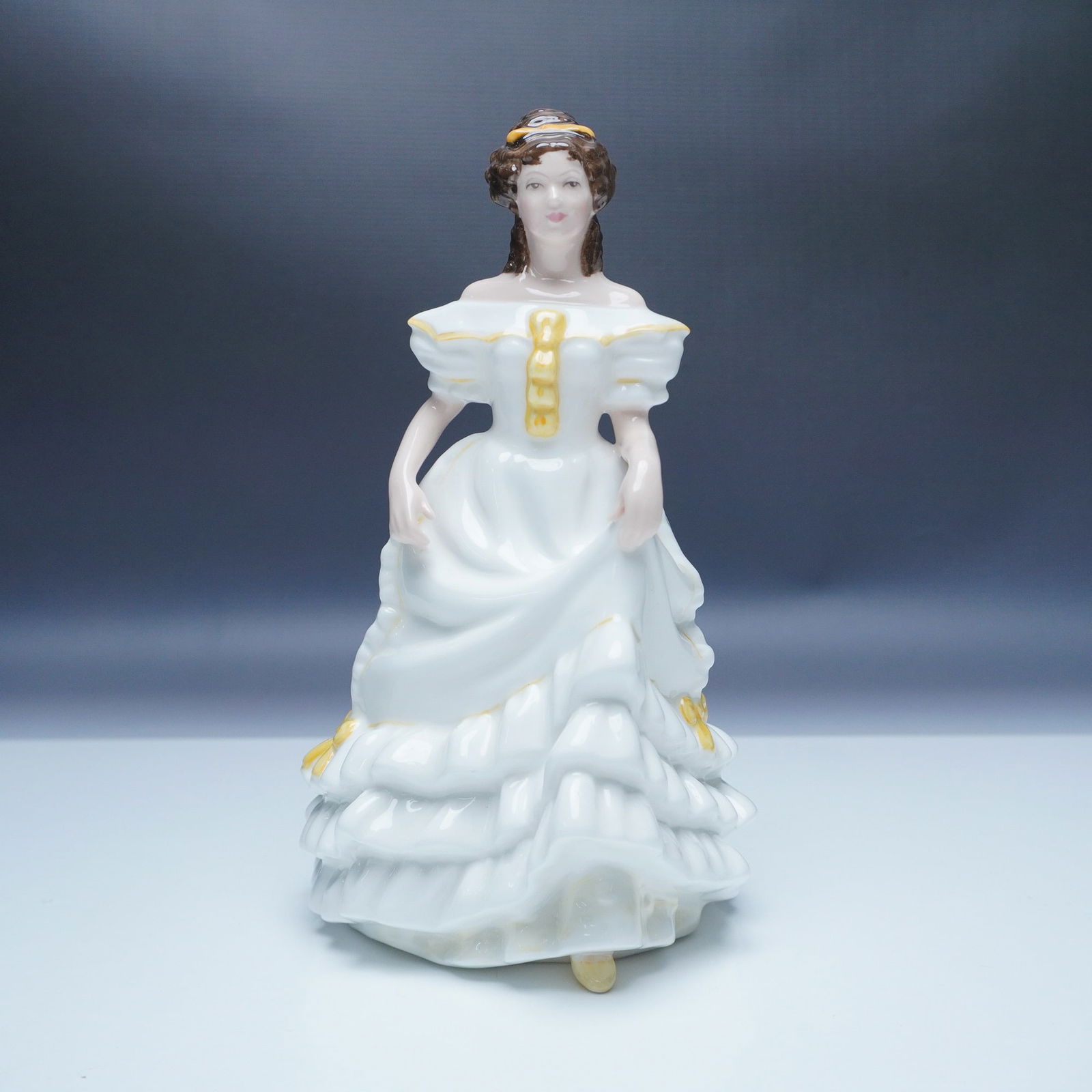 Royal Doulton Figurine Angela HN3690: This exquisite Royal Doulton figurine, Angela (HN3690), showcases the brand's timeless craftsmanship. Introduced in 1994, this porcelain figurine depicts a graceful young woman in a flowing white gown