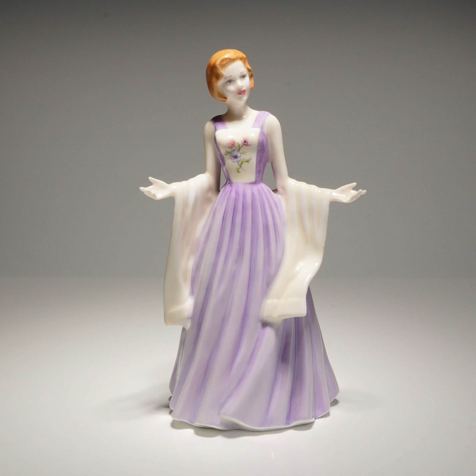 Royal Doulton Figurine Julia HN 4390: A Royal Doulton bone china figurine titled Julia, model number HN 4390, from the Royal Doulton Classics collection. Modeled by Nada M. Pedley and dated 2001, this hand-made and hand-decorated figure d