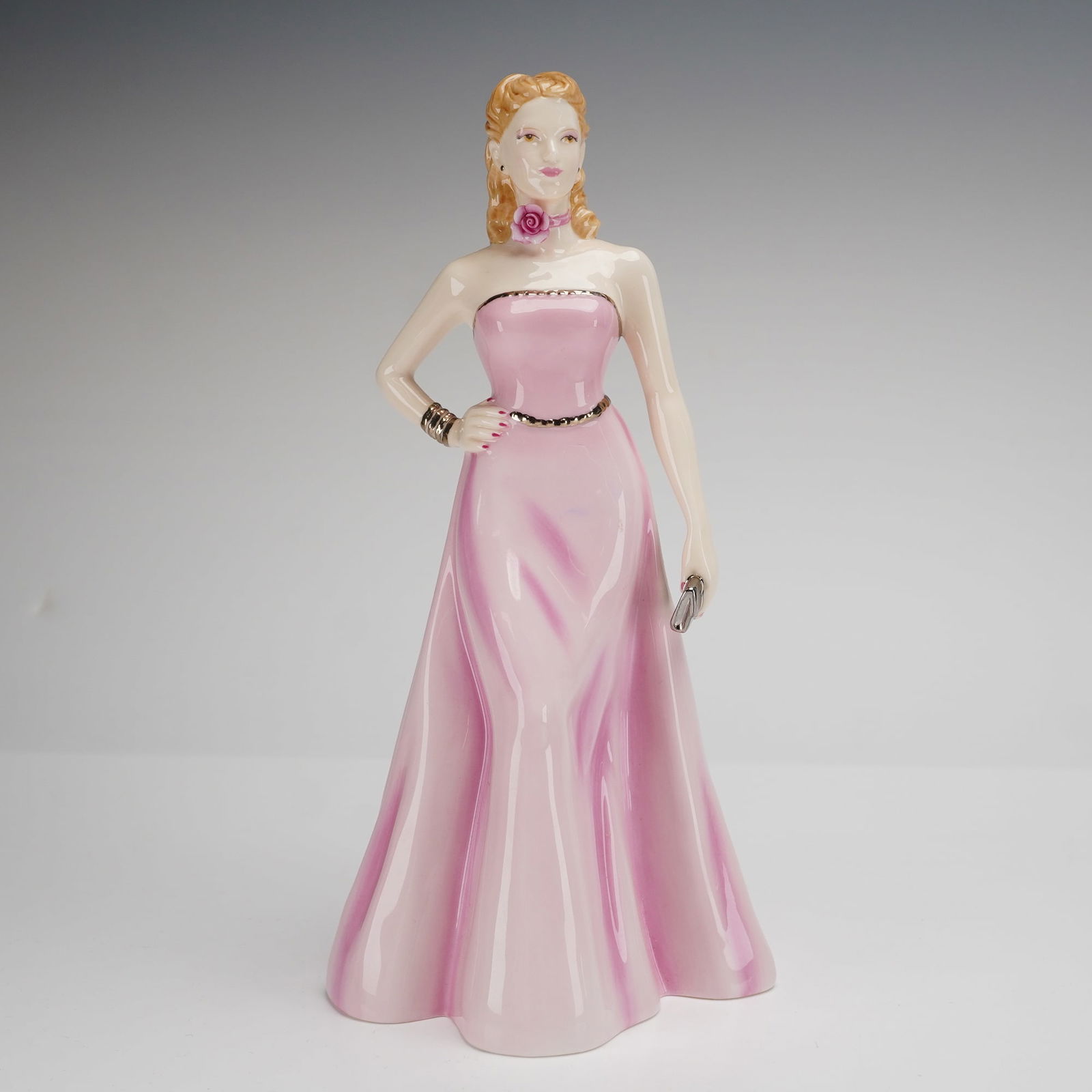 Royal Doulton Pretty Ladies Figurine Olivia HN 4766: A Royal Doulton bone china figurine titled Olivia, model number HN 4766, from the Pretty Ladies series. This hand-made and hand-decorated piece was modeled by Nada M. Pedley and is dated 2005. The fig