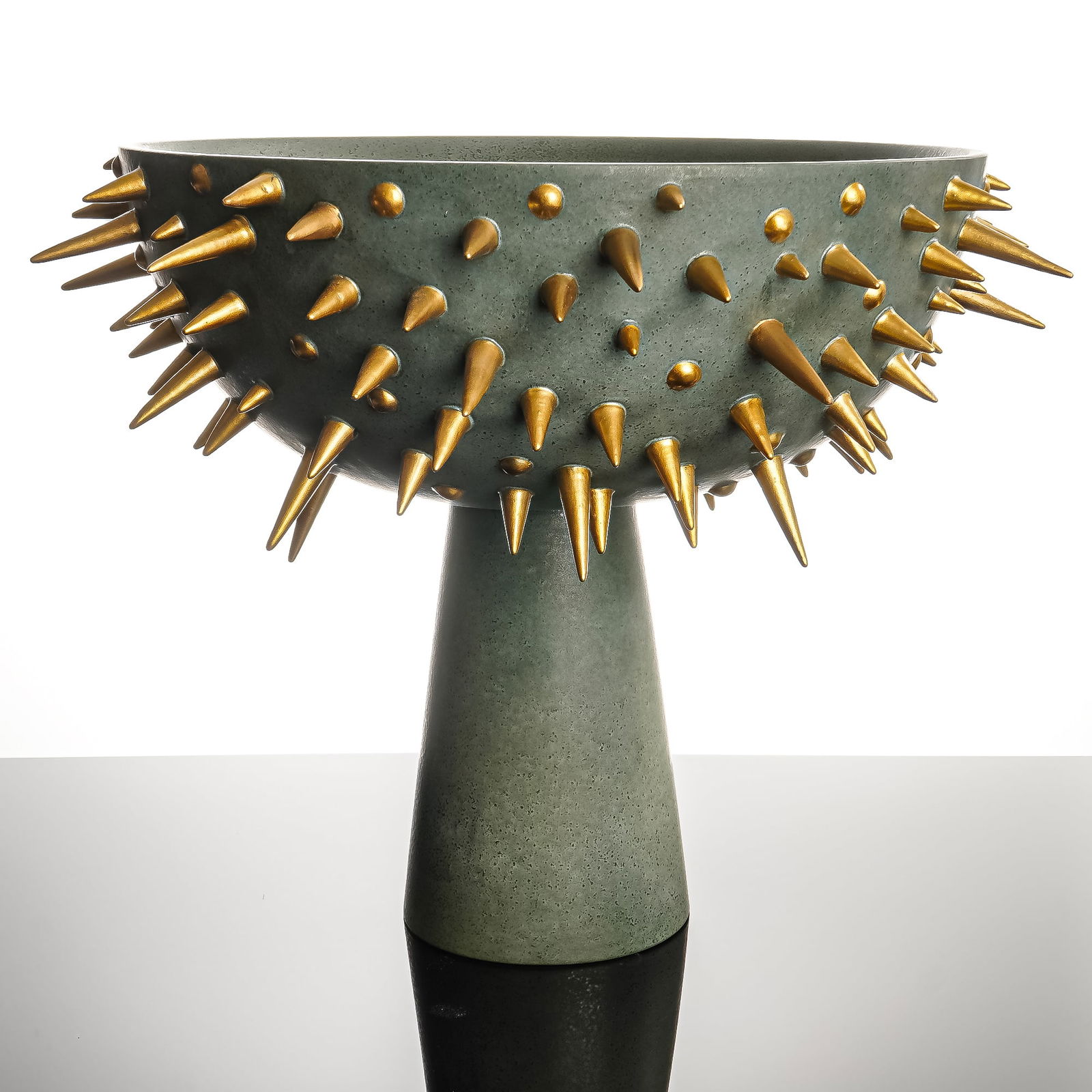 L'Objet Celestial Bowl Studded Bowl on Stand: Sculptural and boldly contemporary, this L'Objet Celestial studded bowl features a dramatic hemispherical form adorned with raised gilt spike and stud detailing throughout. Finished in a muted green-g