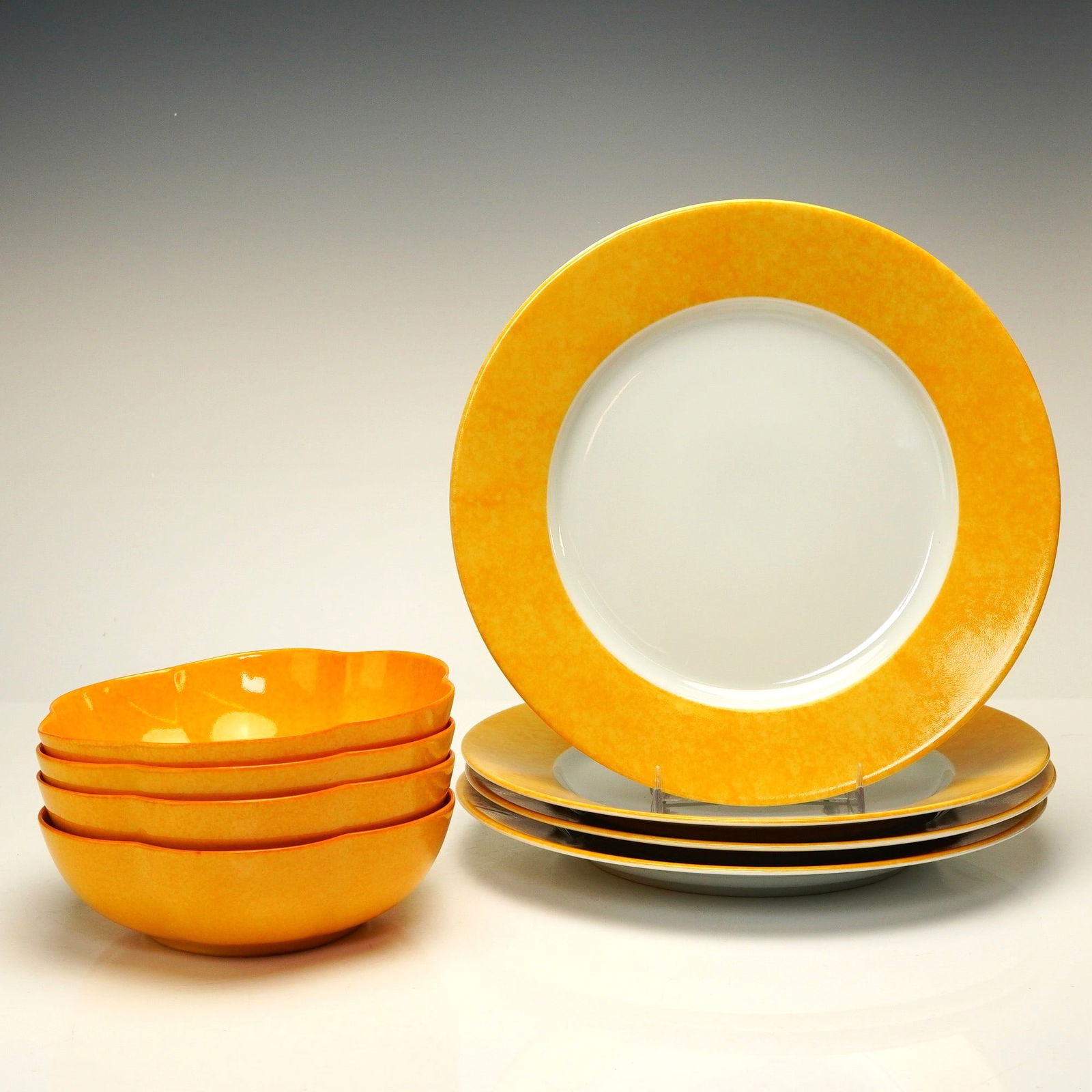 8pc Laure Japy Paris Limoges France Porcelain Plate and Bowl Set: An eight-piece set of Laure Japy Paris Limoges porcelain dinnerware in the Mouchete pattern, produced for Barneys New York. The collection includes four 10" dinner plates and four 6.5" scalloped bowls