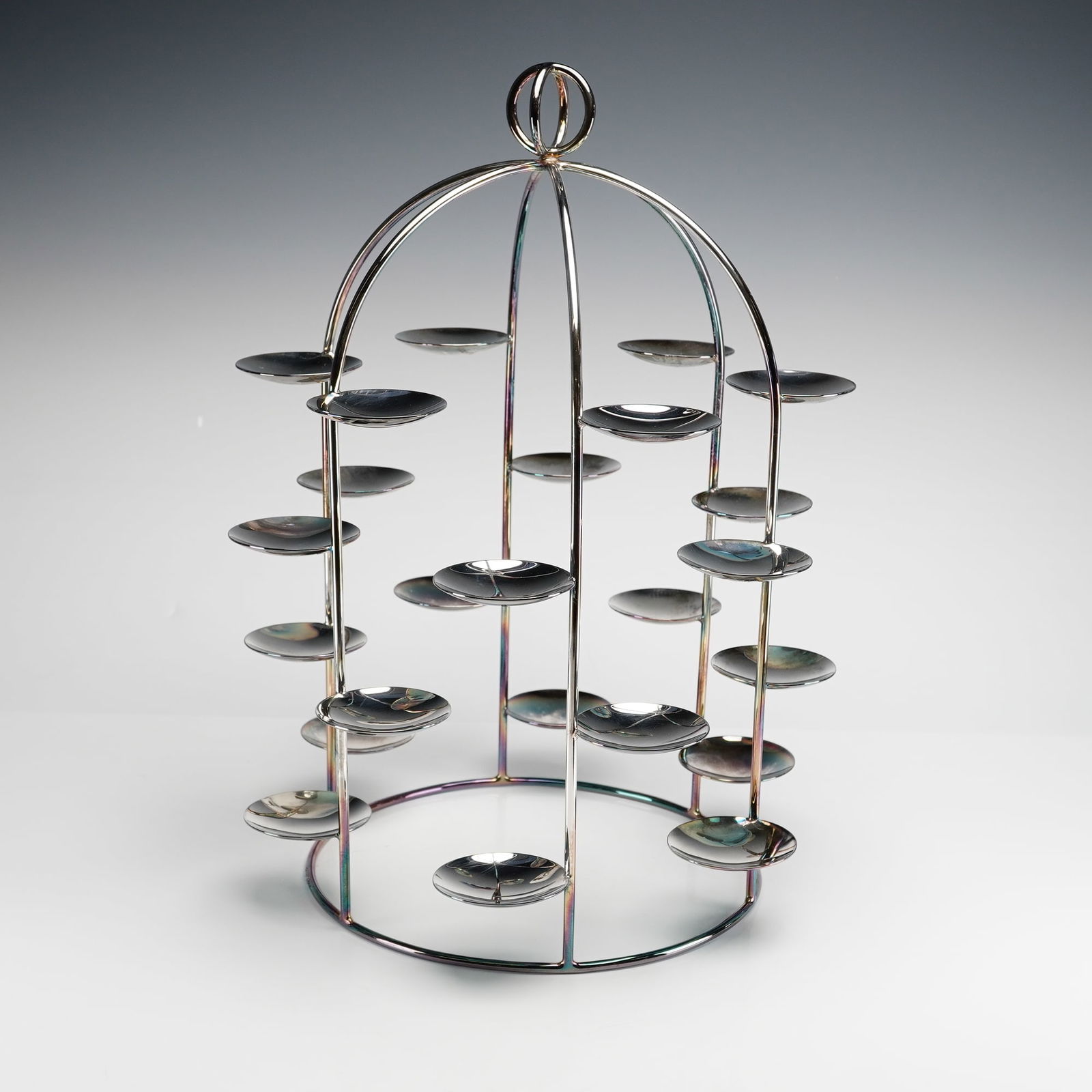 Ercuis Latitude Petits Fours Stand with 24 Small Dishes: Silver-plated petits fours stand features 24-tiered dishes. The server is designed in a stylized birdcage form with a circular base supporting vertical ribs that arch to form a domed top, finished wit