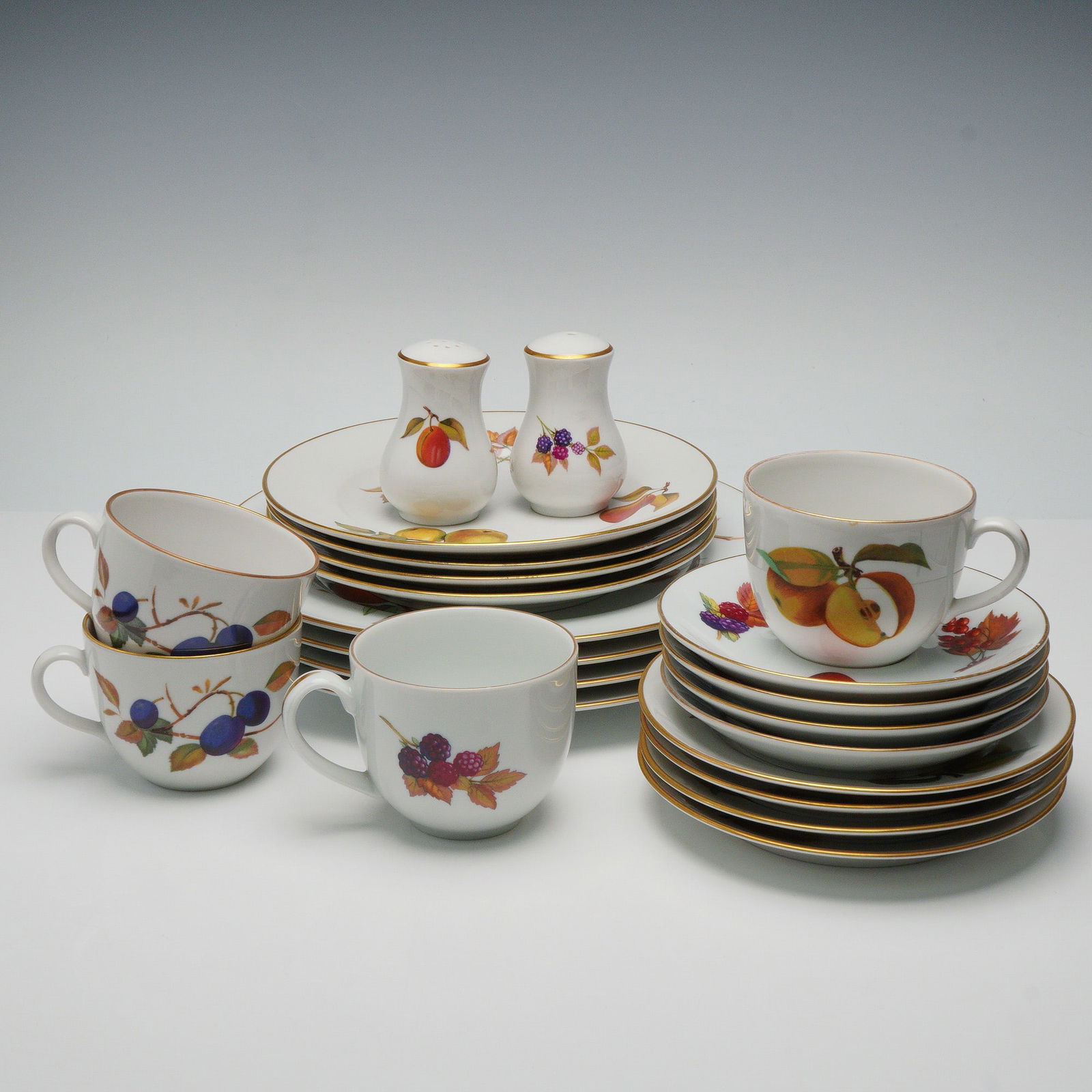 22pc Royal Worcester Porcelain Dinnerware Set-Service for 4, Evesham: Elegant Evesham pattern set provides service for four and includes four dinner plates, four salad plates, four bread-and-butter plates, four teacups with saucers, and a matching pair of salt and peppe