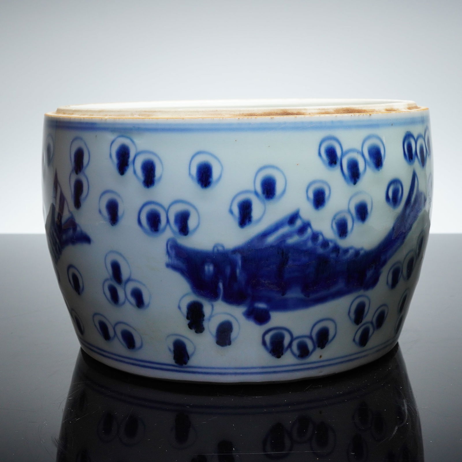 Chinese Blue and White Porcelain Cylindrical Jar with Fish Motifs: A Chinese porcelain cylindrical jar executed in the Blue and White style. The decoration is applied using underglaze cobalt pigment. The vessel features a continuous band of decoration depicting