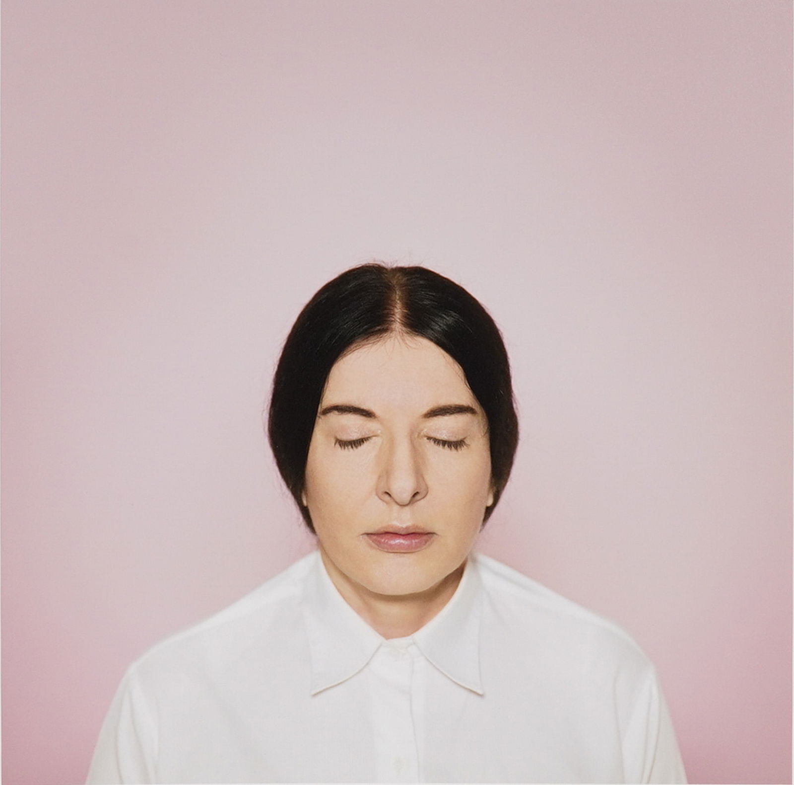 Marina Abramovic (Serbian b.1946) Fine Art Pigment Print, Signed & Numbered: This fine art pigment print on cotton paper presents a serene, meditative portrait rendered against a soft pink ground. The work exemplifies Marina Abramovic's longstanding engagement with presence, s