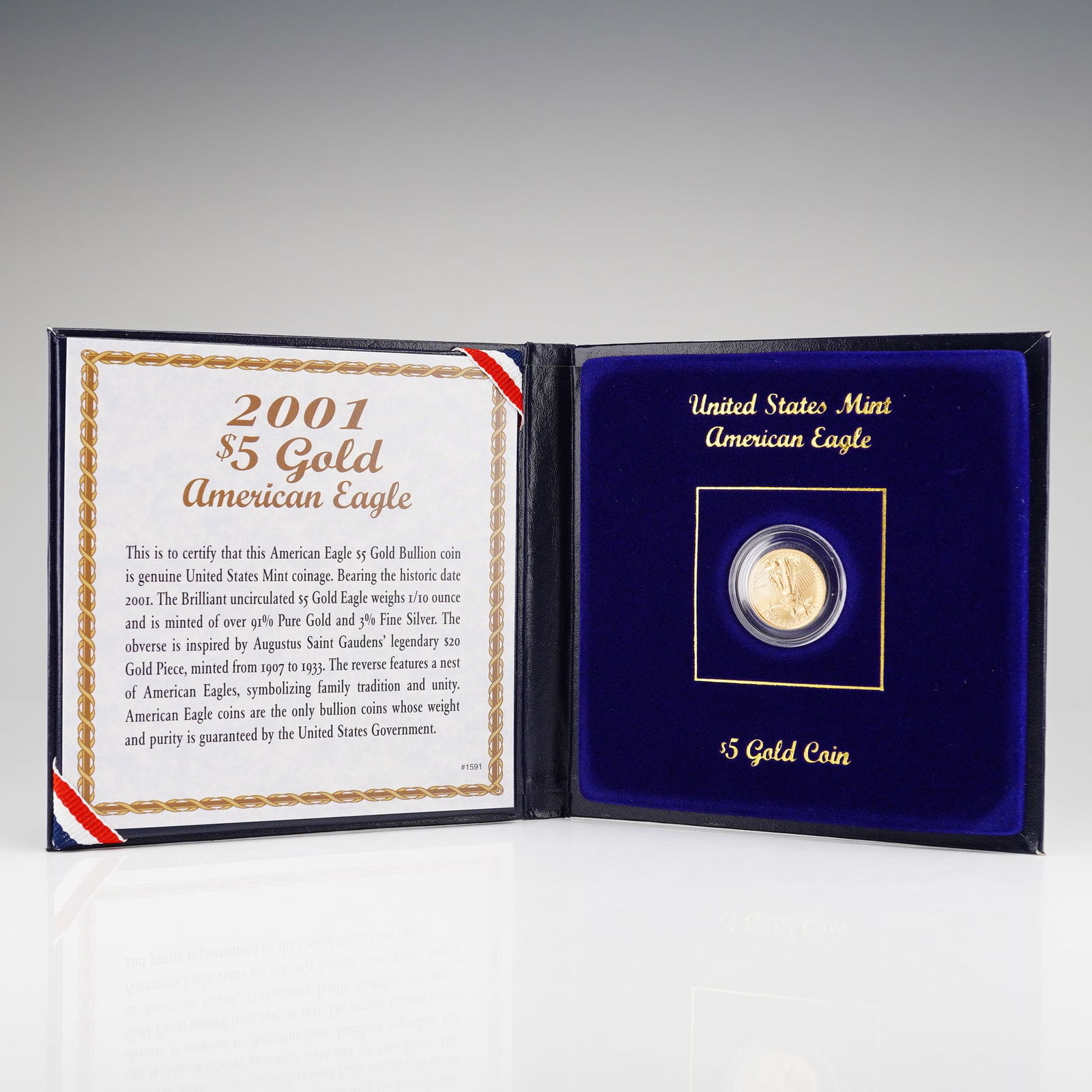 2001 United States Mint $5 American Gold Eagle 1/10 oz. Bullion Coin: The obverse features Augustus Saint-Gaudens' iconic effigy of Liberty with the date to the right, while the reverse, designed by Miley Frost, showcases an eagle in flight above a nest of eaglets, with