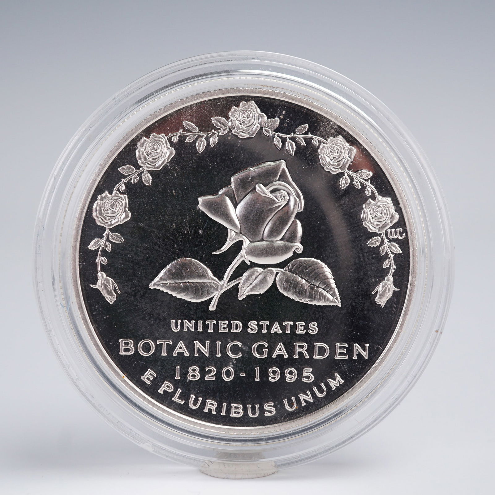 1997-P U.S. Mint Botanic Garden Silver Dollar Proof: Commemorative silver dollar issued to honor the 175th anniversary of the United States Botanic Garden, marked 1820-1995. Philadelphia Mint, proof strike, housed in its original blue U.S. Mint