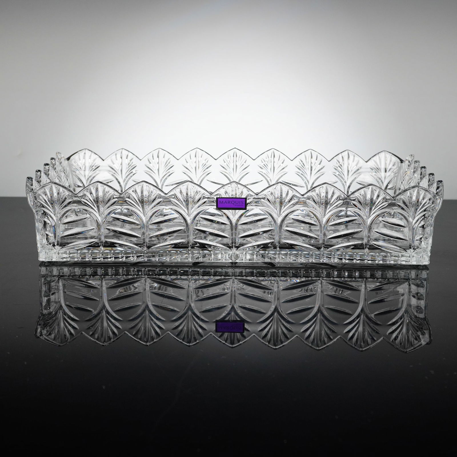 Marquis by Waterford Wheat Pattern Lead Crystal Bread Basket: A rectangular Marquis by Waterford lead crystal bread basket in the Wheat pattern that features deep-cut repeating wheat stalk motifs along the sides and a scalloped upper rim. The base is decorated w