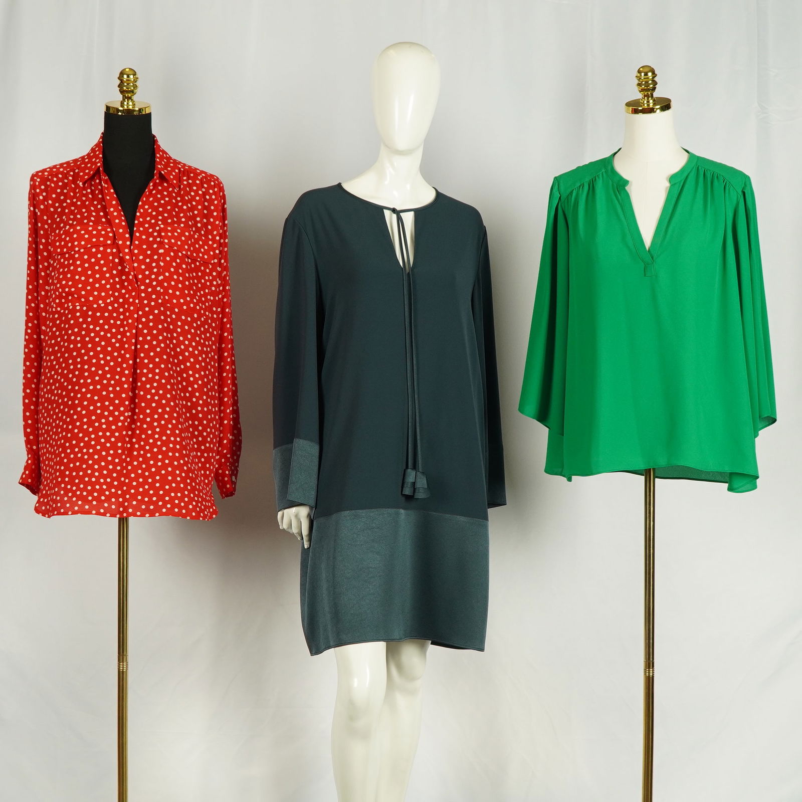 3pc Paule Ka, Neiman Marcus, and Ann Taylor Women Shirts & Dress: A chic trio of contemporary women's garments including a Paule Ka Paris teal tunic dress featuring a soft drape, tassel tie neckline, and tonal satin trim; a vibrant lightweight emerald green Neiman