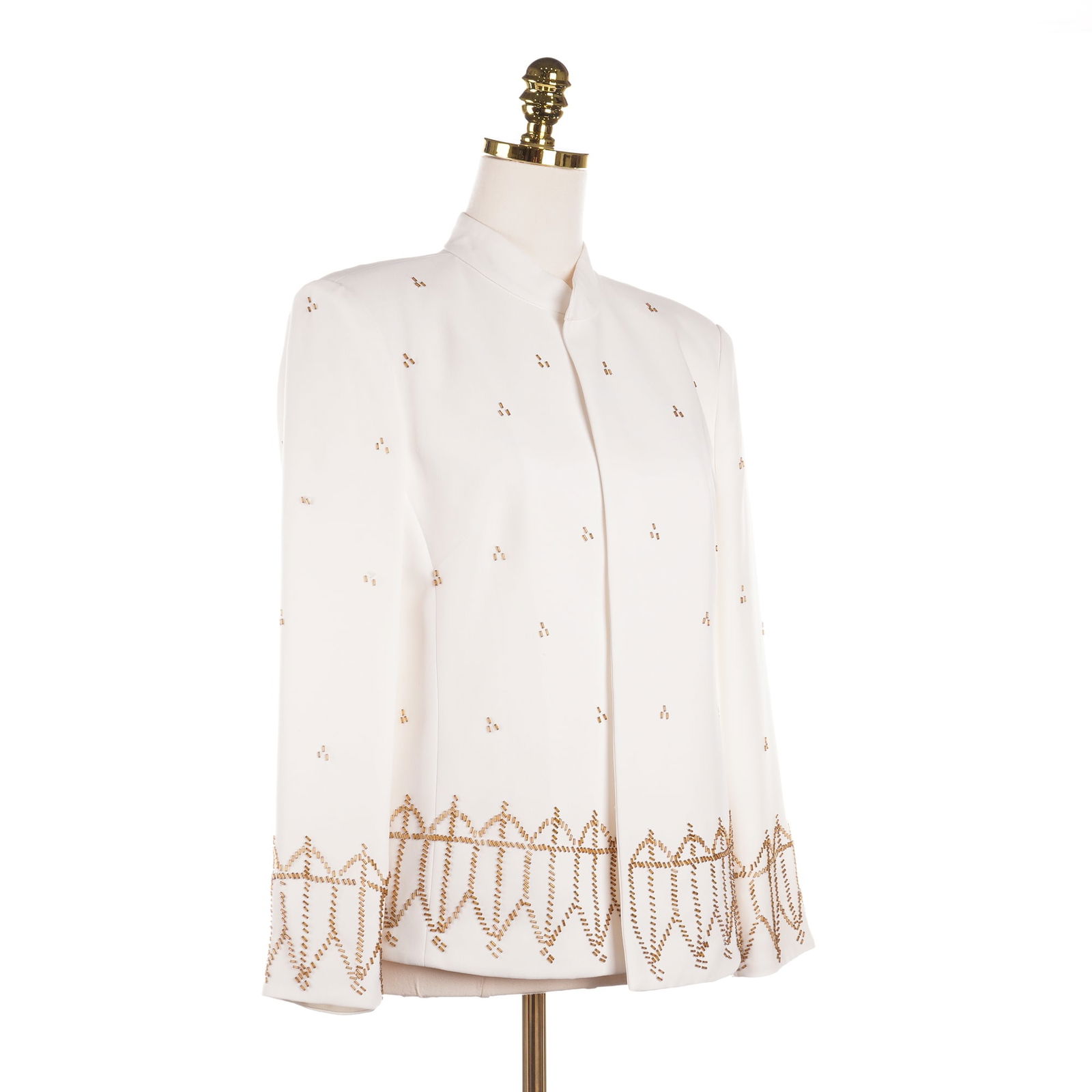 Draper's & Damon's White Evening Jacket w/ Gold Tone Beaded Accents: An elegant Draper's & Damon's white evening jacket with gold tone beaded accents. It features a Mandarin collar and a hidden front closure. The jacket is embellished with gold-toned bugle beadwork in