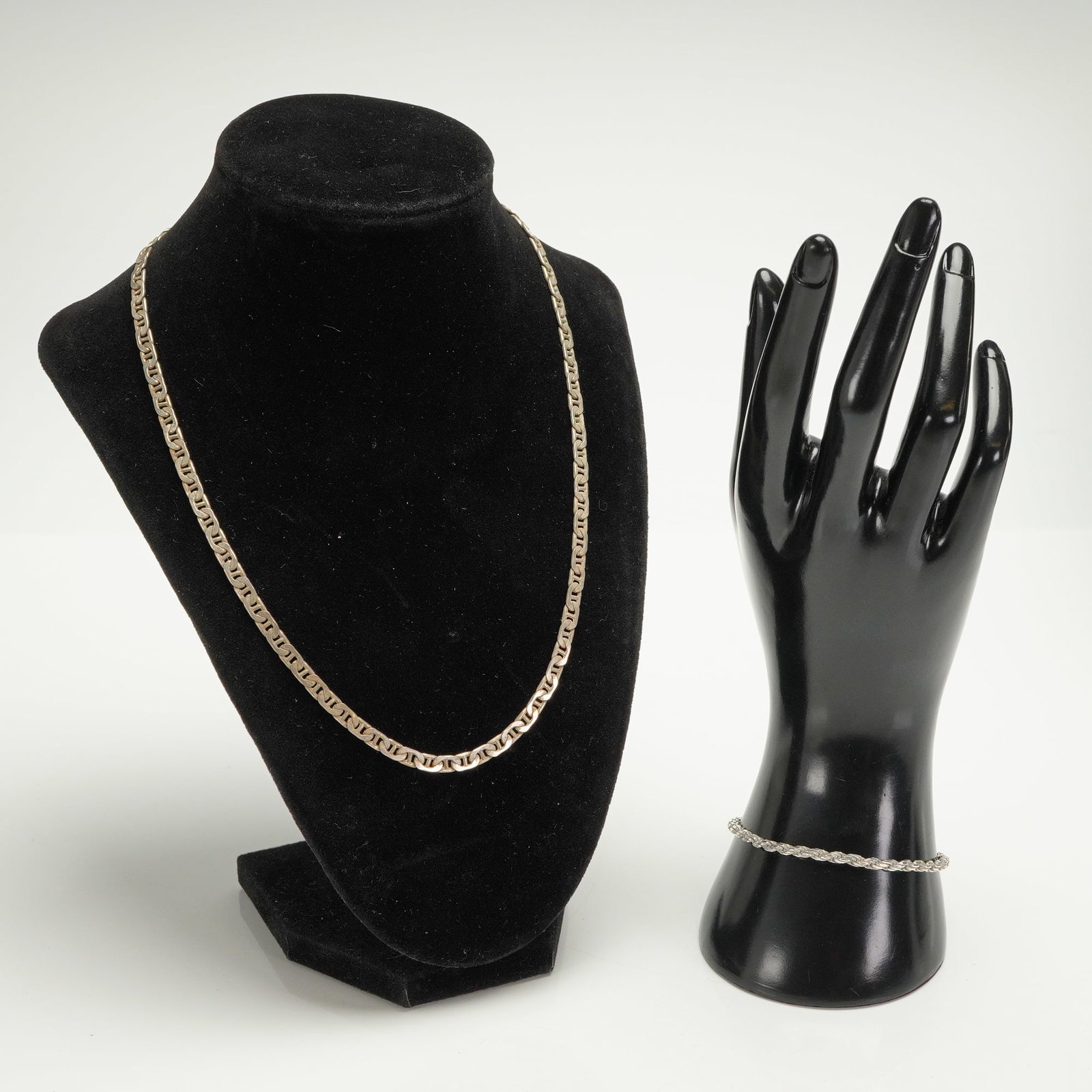 2pc Sterling Silver Mariner Link Necklace and Rope Chain Bracelet Set: A two-piece set of sterling silver (.925 standard) jewelry consisting of a necklace and a bracelet. The necklace is constructed of flat Mariner or Anchor links. The lobster clasp is stamped "HGT 925"