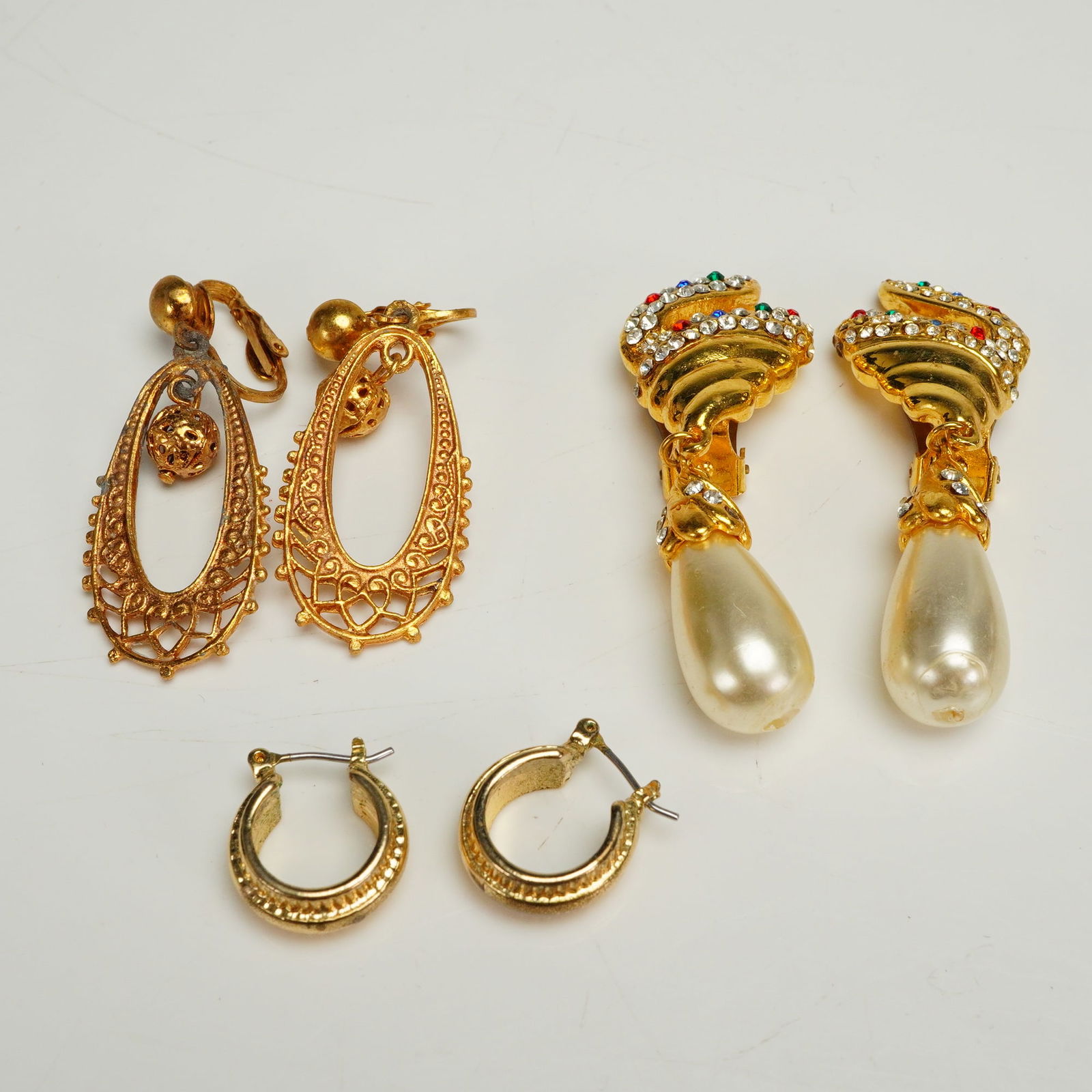 A Collection of Three Pairs of Gold-Tone Costume Earrings (1 of 5)